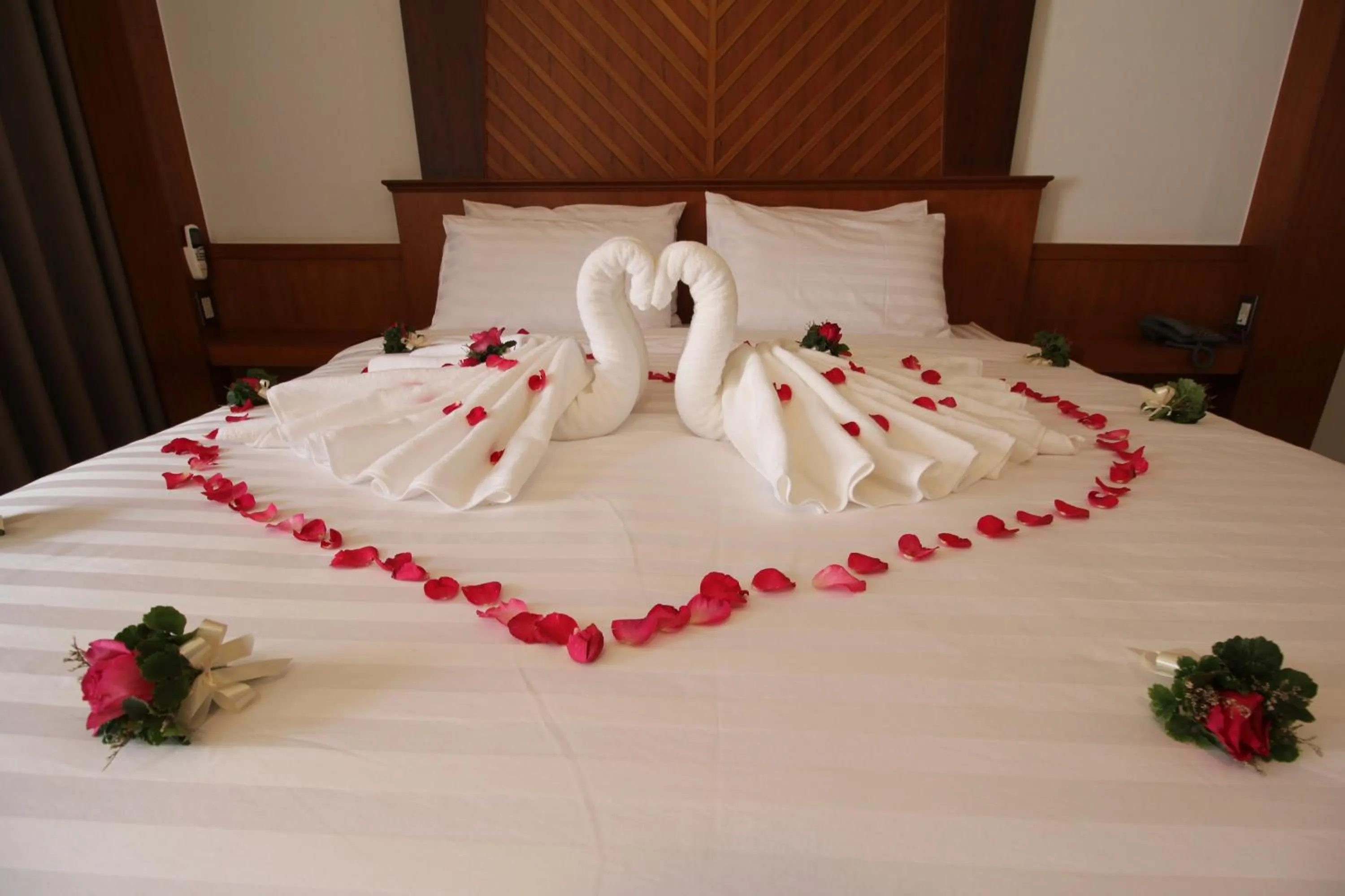 Bed in Nonghan Grand Hotel and Resort