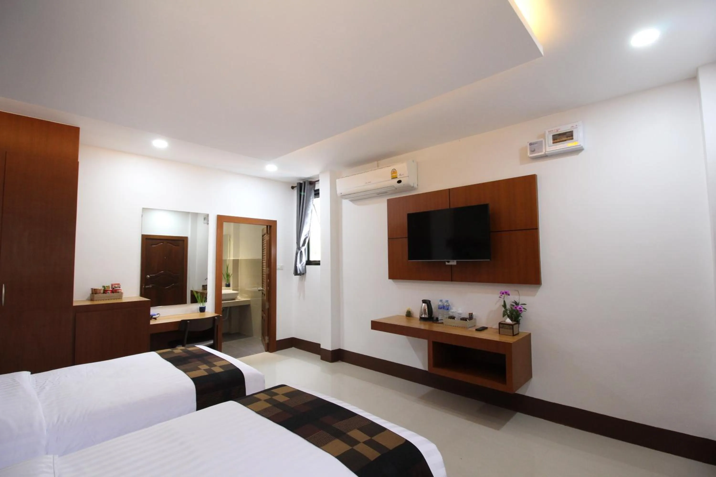 Bed in Nonghan Grand Hotel and Resort