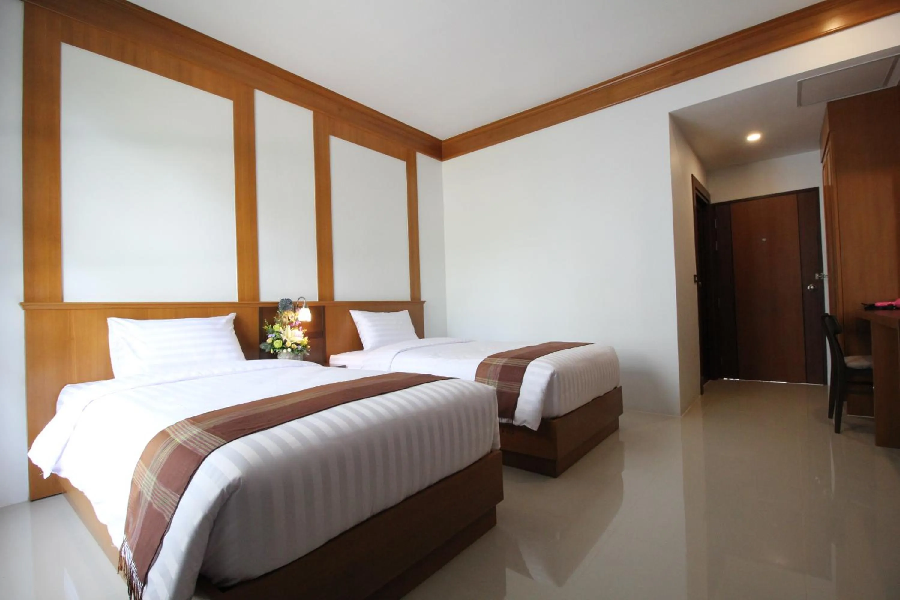 Bed in Nonghan Grand Hotel and Resort