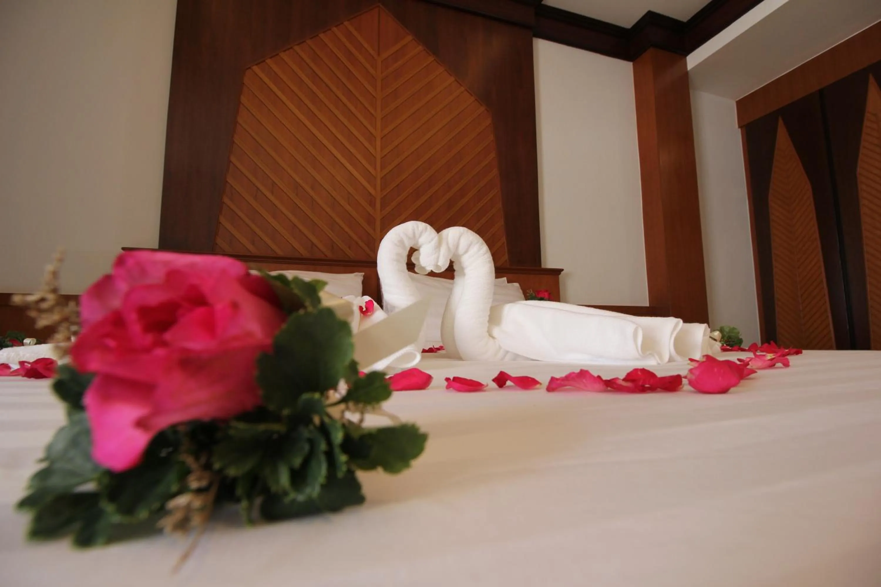 Bed in Nonghan Grand Hotel and Resort