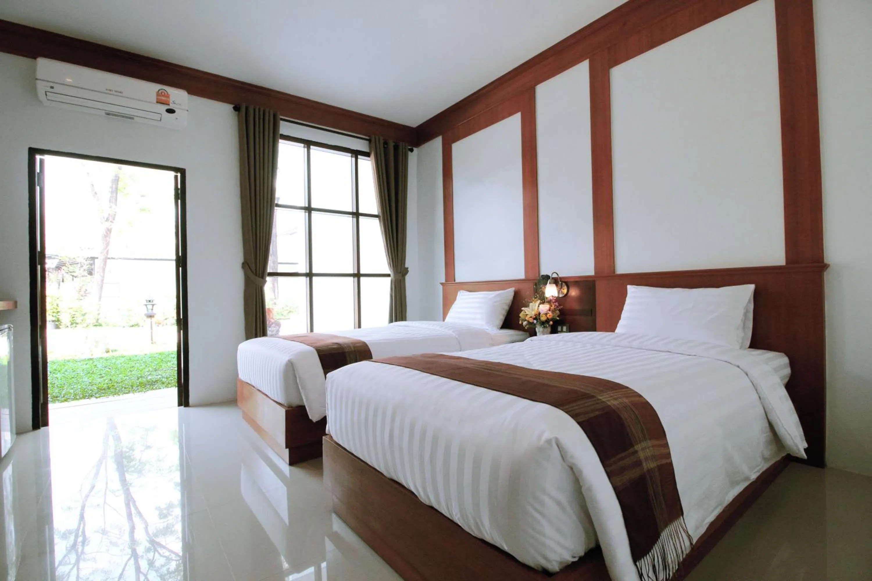 Bed in Nonghan Grand Hotel and Resort