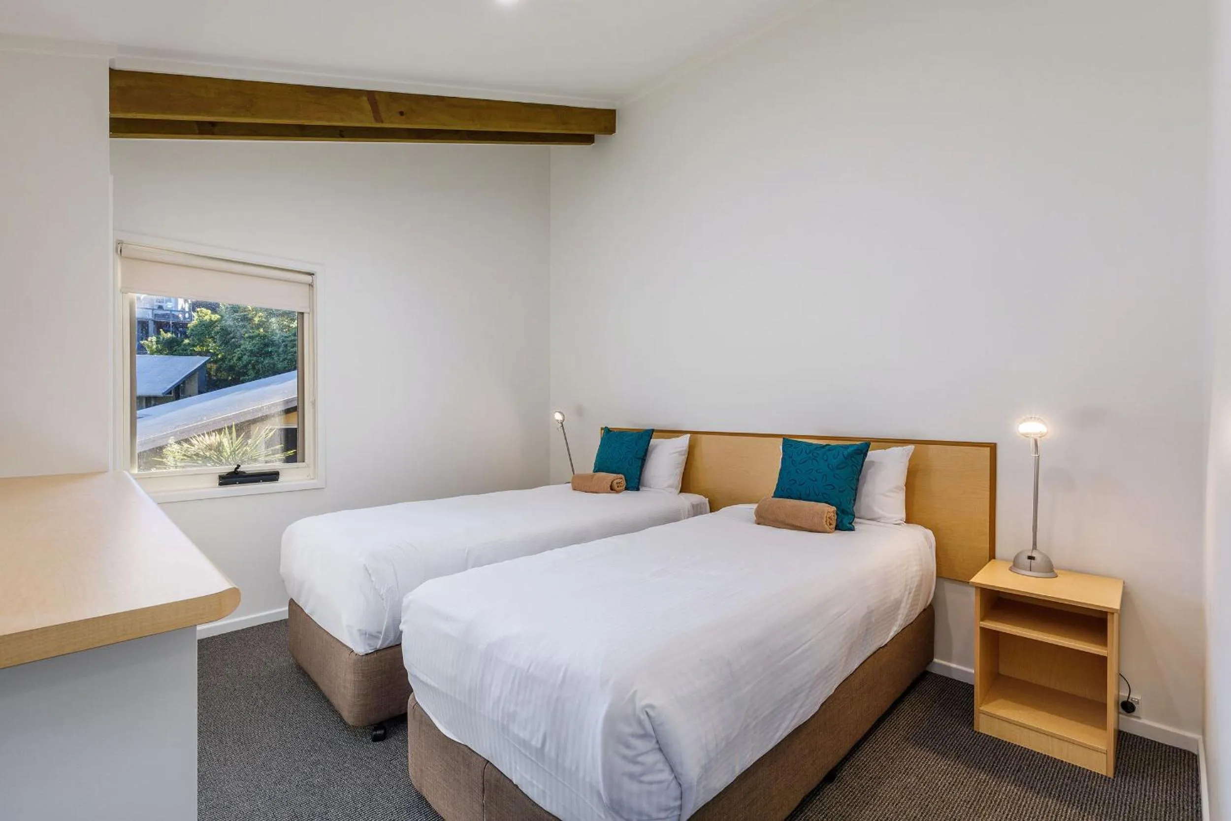 Bed in Tathra Beach House Holiday Apartments