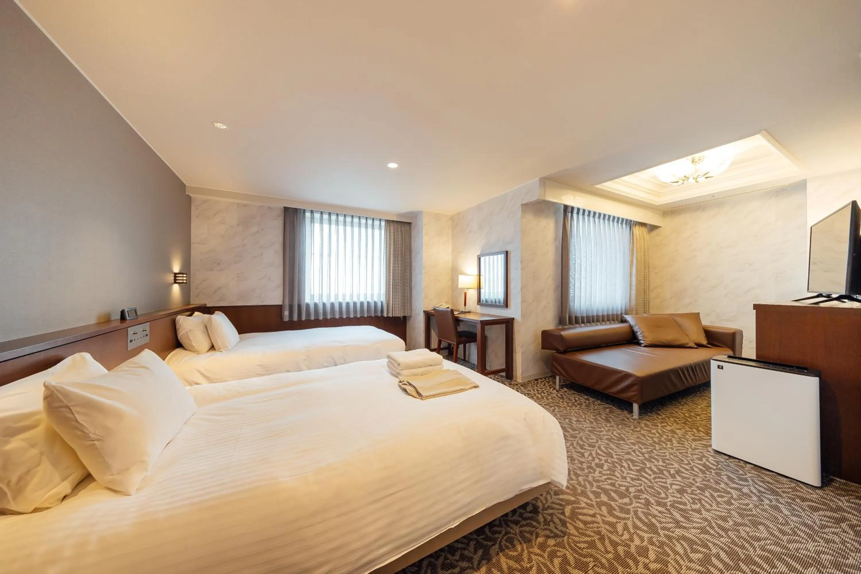 Bed in Kokusai 21 International Hotel