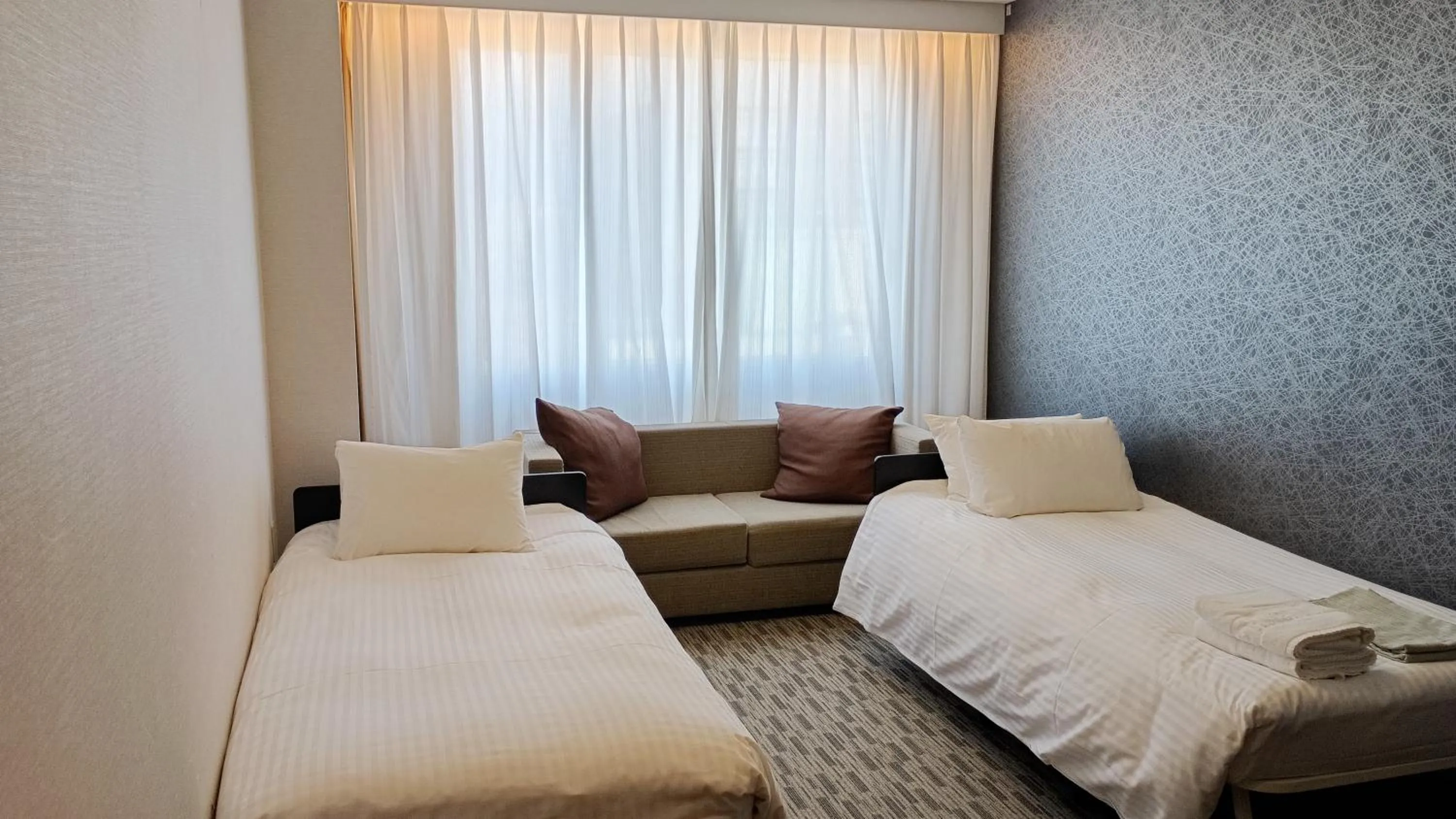 Bed in Kokusai 21 International Hotel