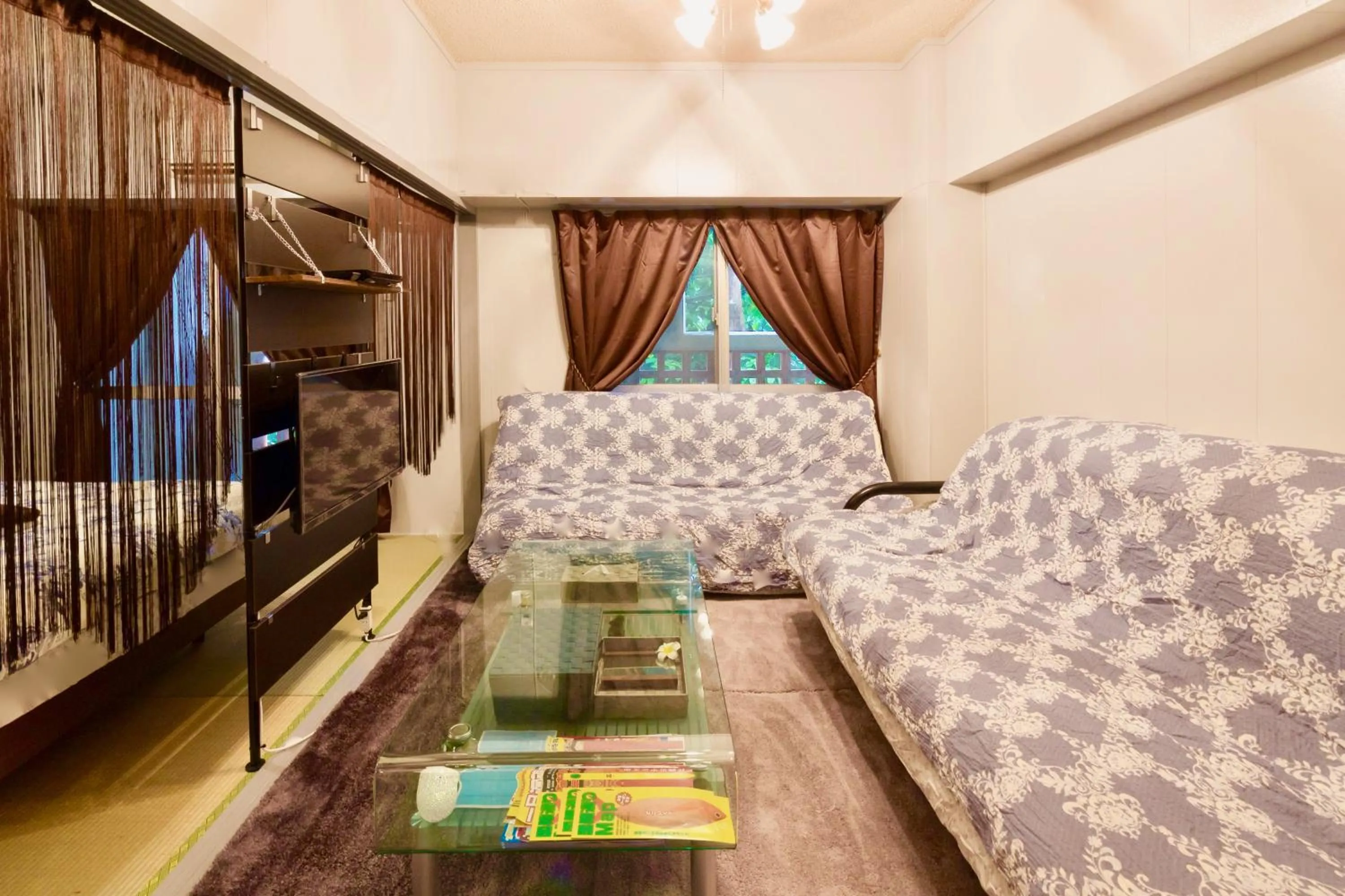 Living room, Bed in Holiday Homes TSUBOYA 202