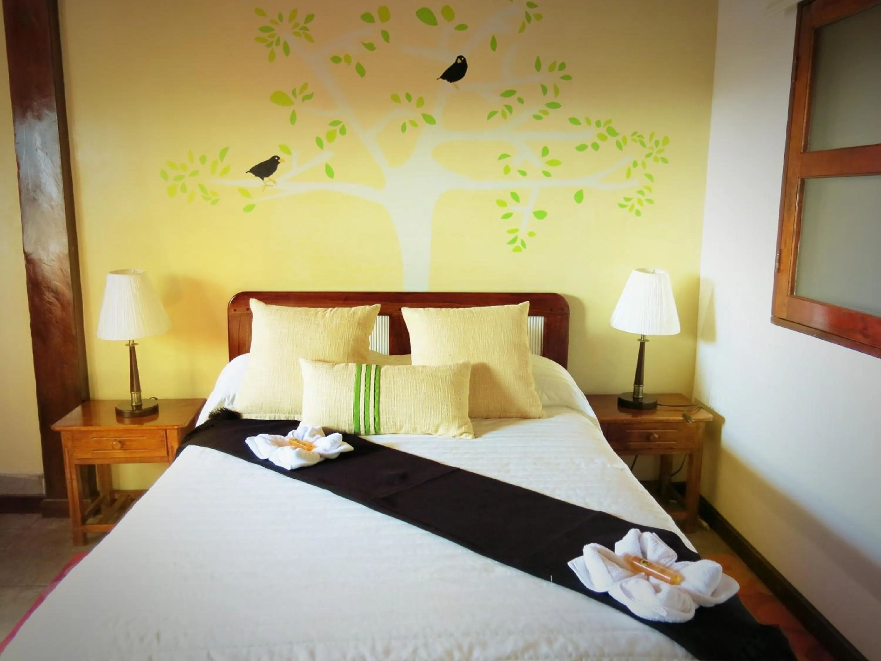 Bed in The Wooden House Hotel