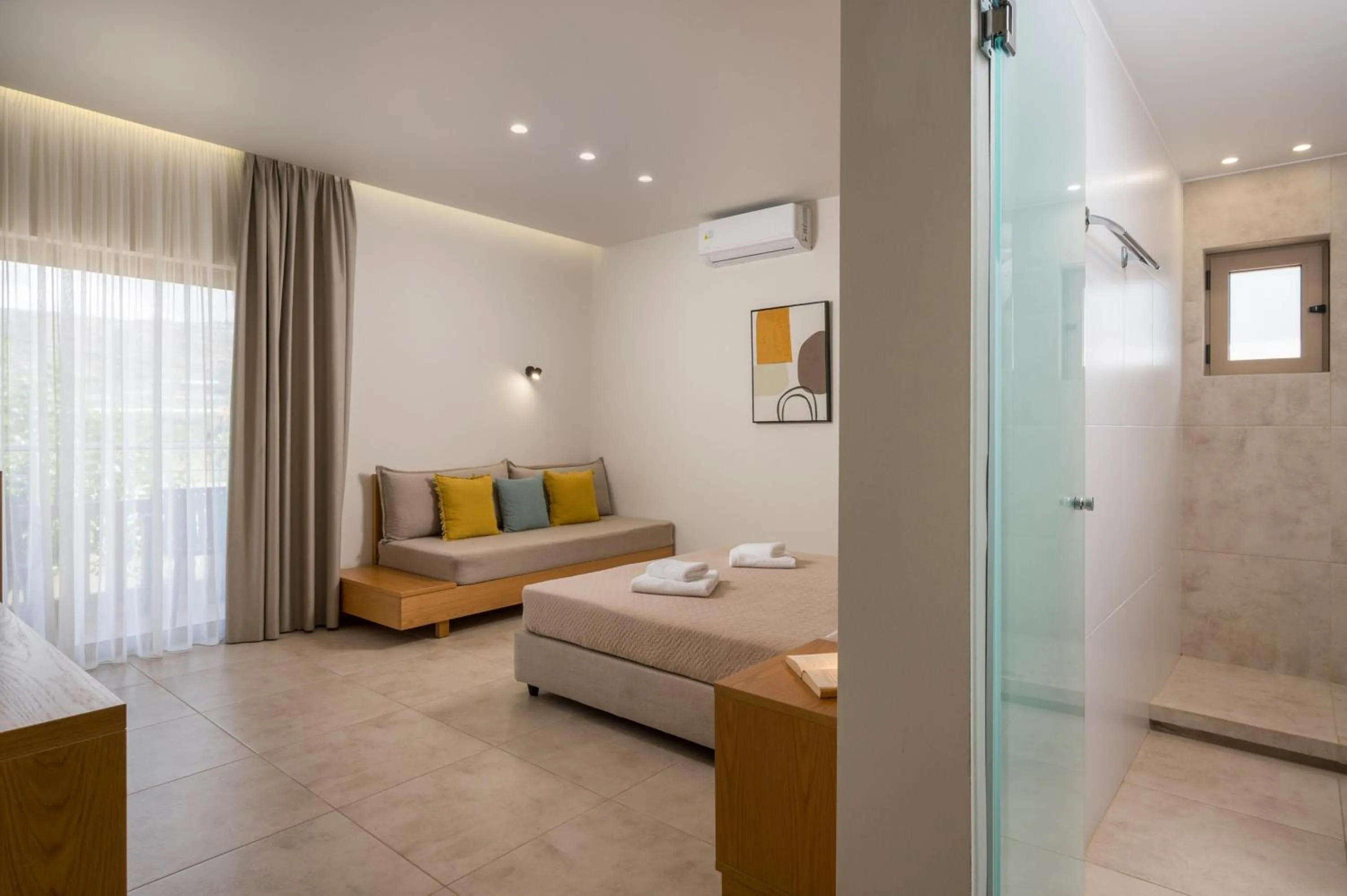 Bed in Petritos Rooms and Studios