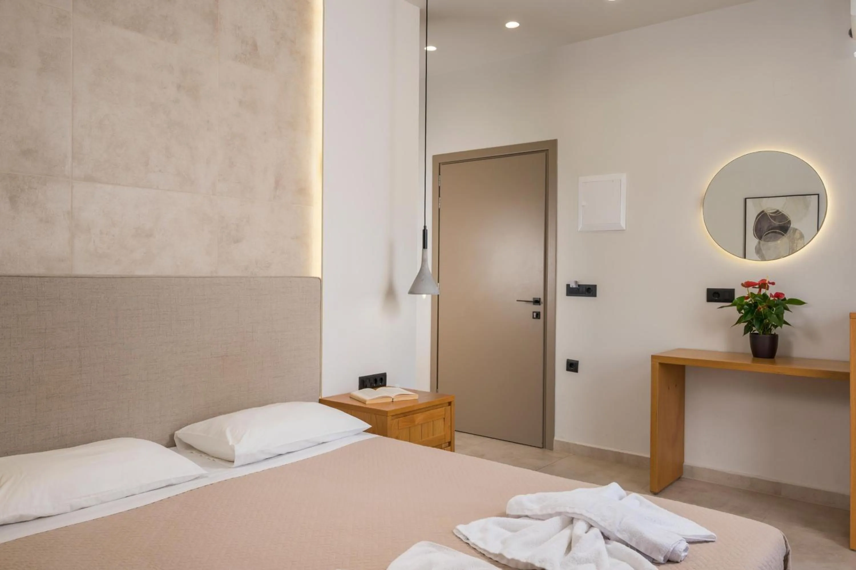 Bed in Petritos Rooms and Studios