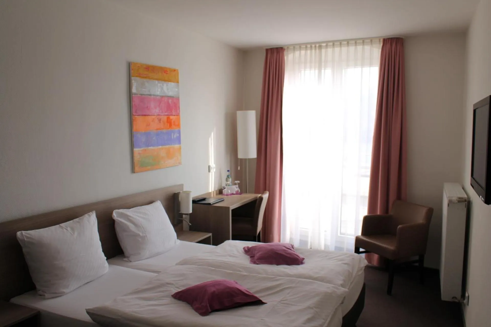 Bed in RheinHotel ARTE