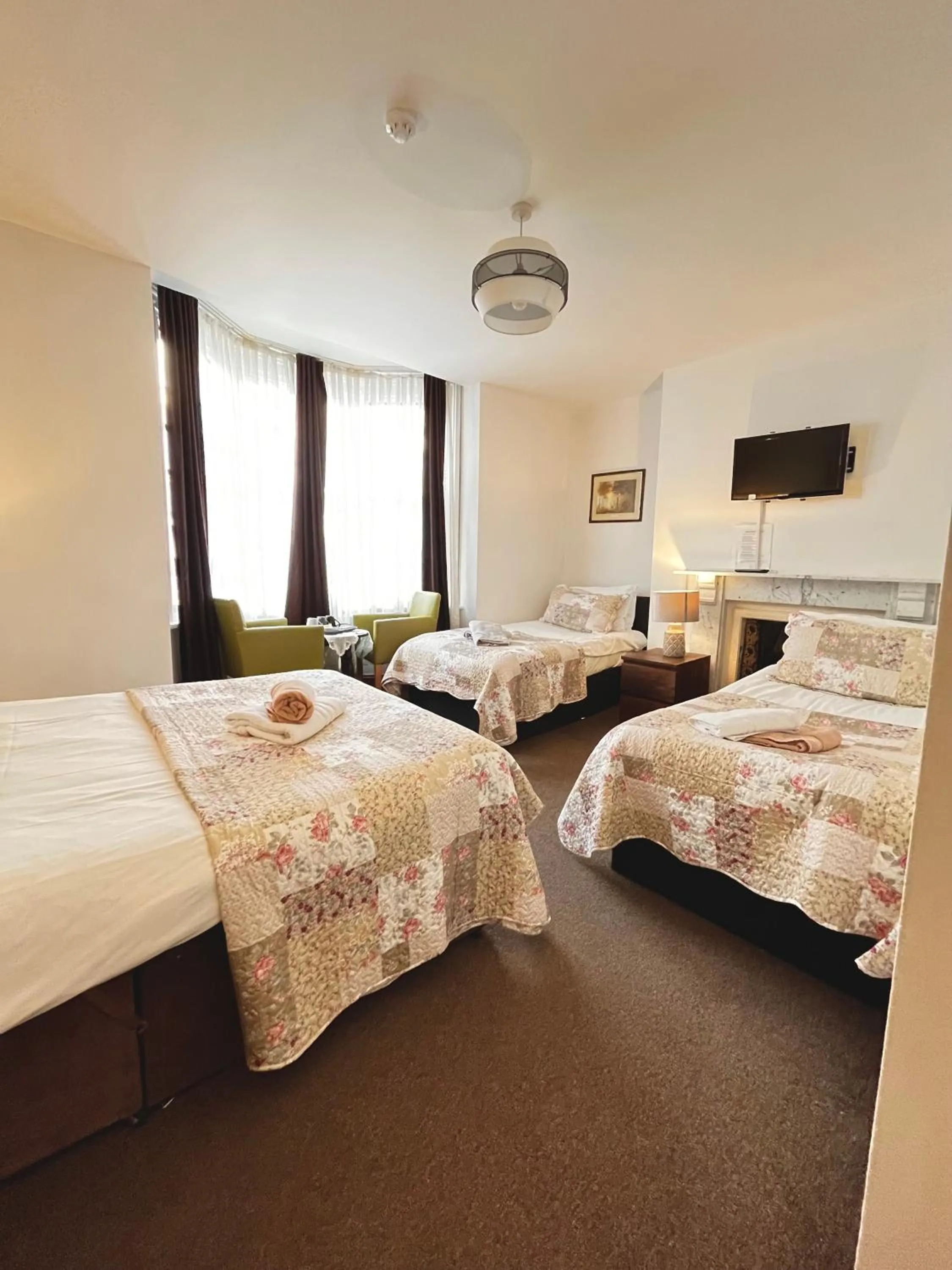 Bed in Old Palace Guest House