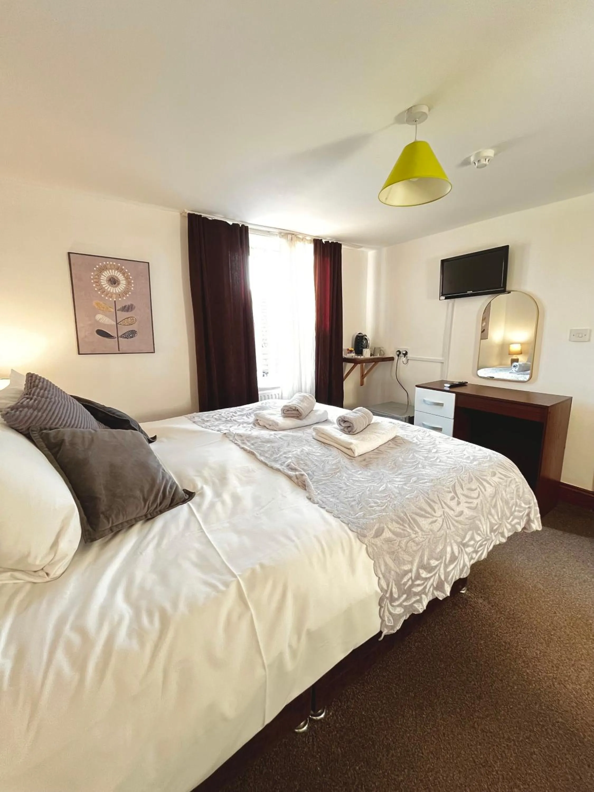 Bed in Old Palace Guest House