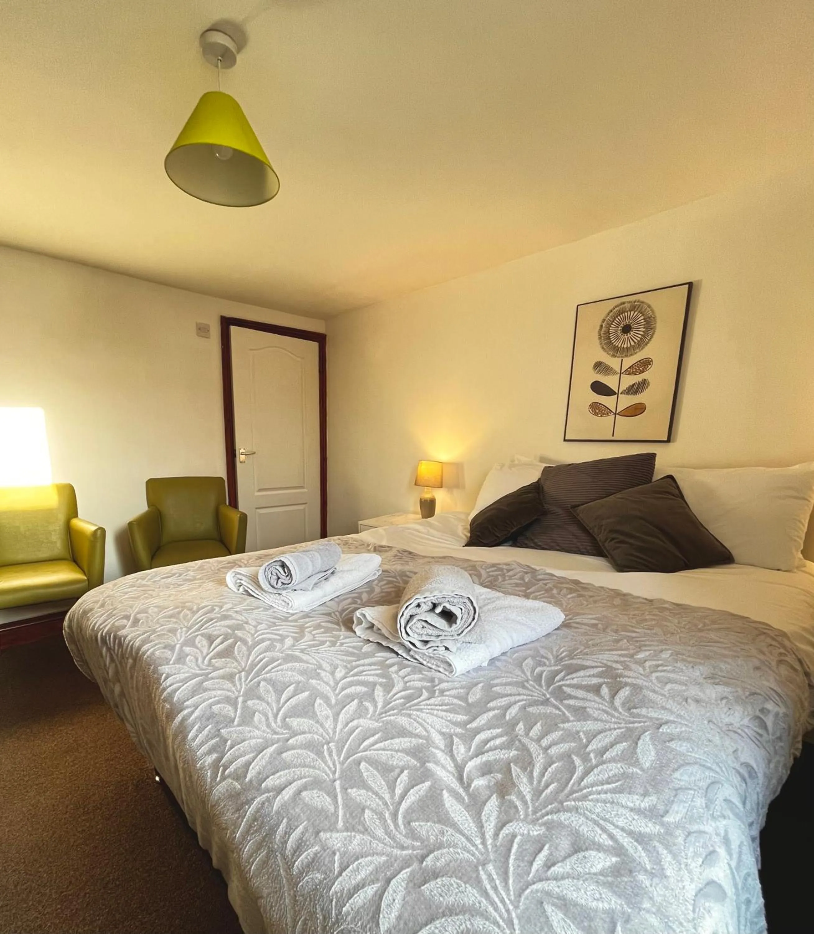 Bed in Old Palace Guest House