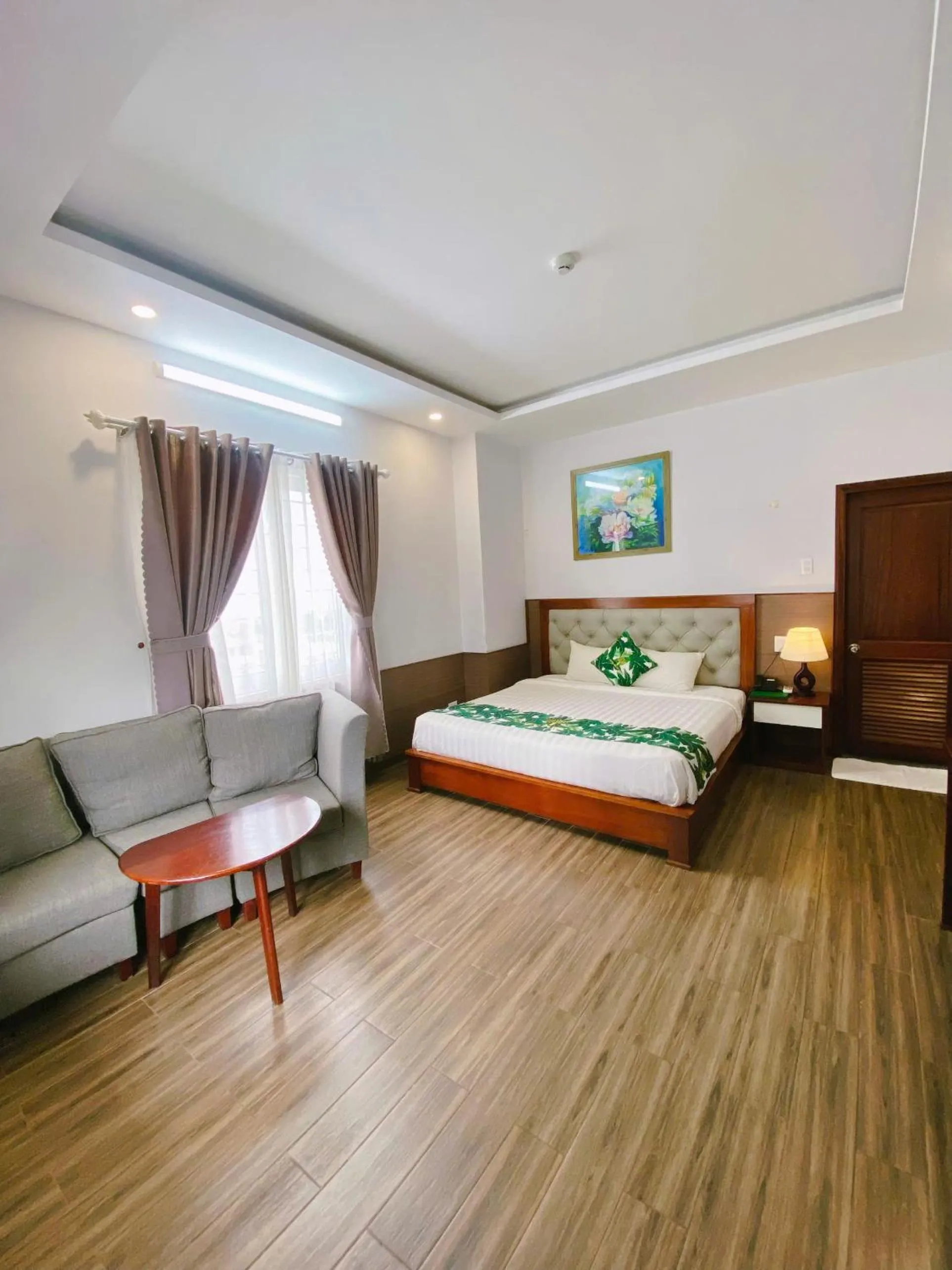 Bed in Flora Quy Nhon Hotel