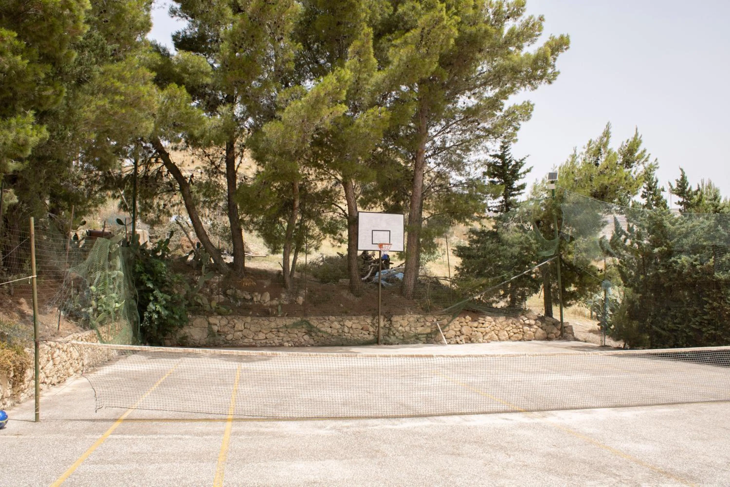 Tennis court in Agriturismo Bellajo - Ville Rustiche con Piscina