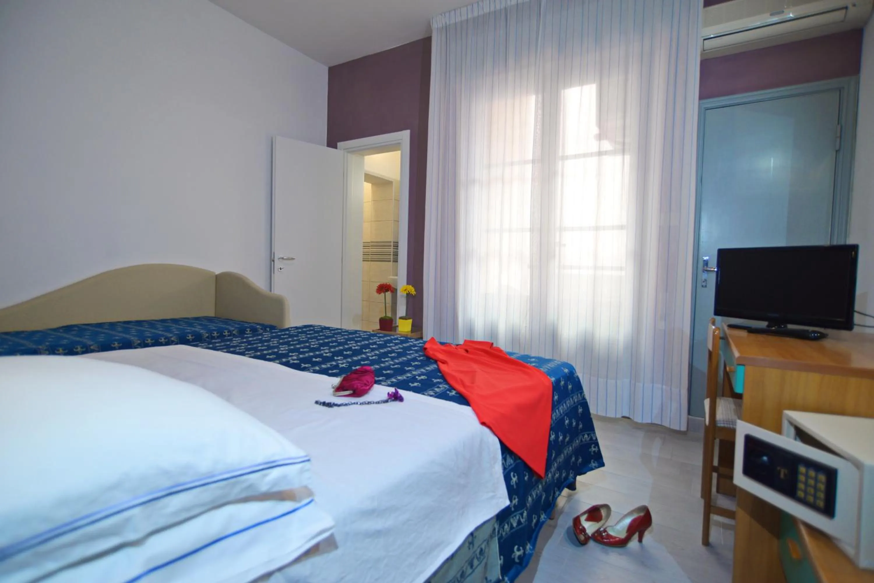 Photo of the whole room, Bed in Hotel Iride Apartments & Rooms- ideale per famiglie e coppie