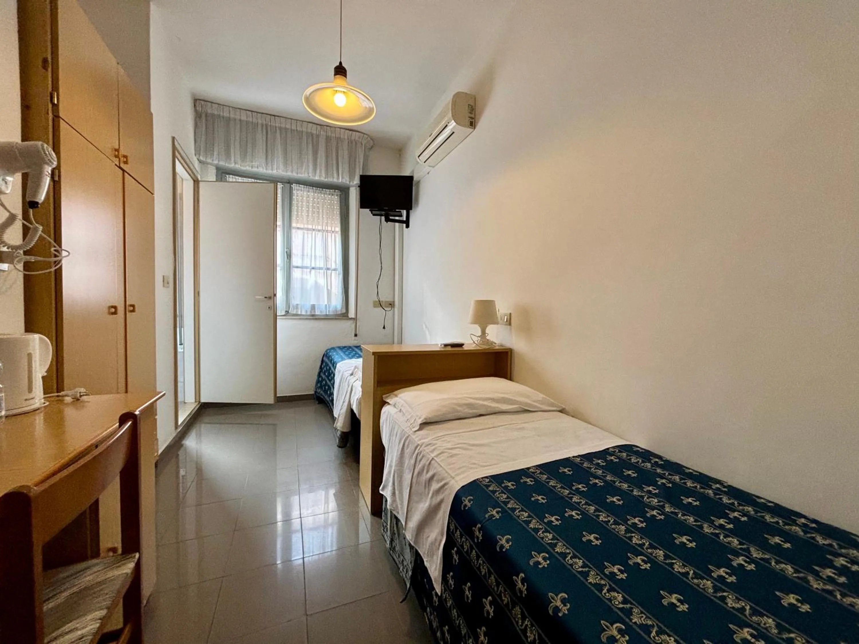 Bedroom, Bed in Hotel Iride Apartments & Rooms- ideale per famiglie e coppie