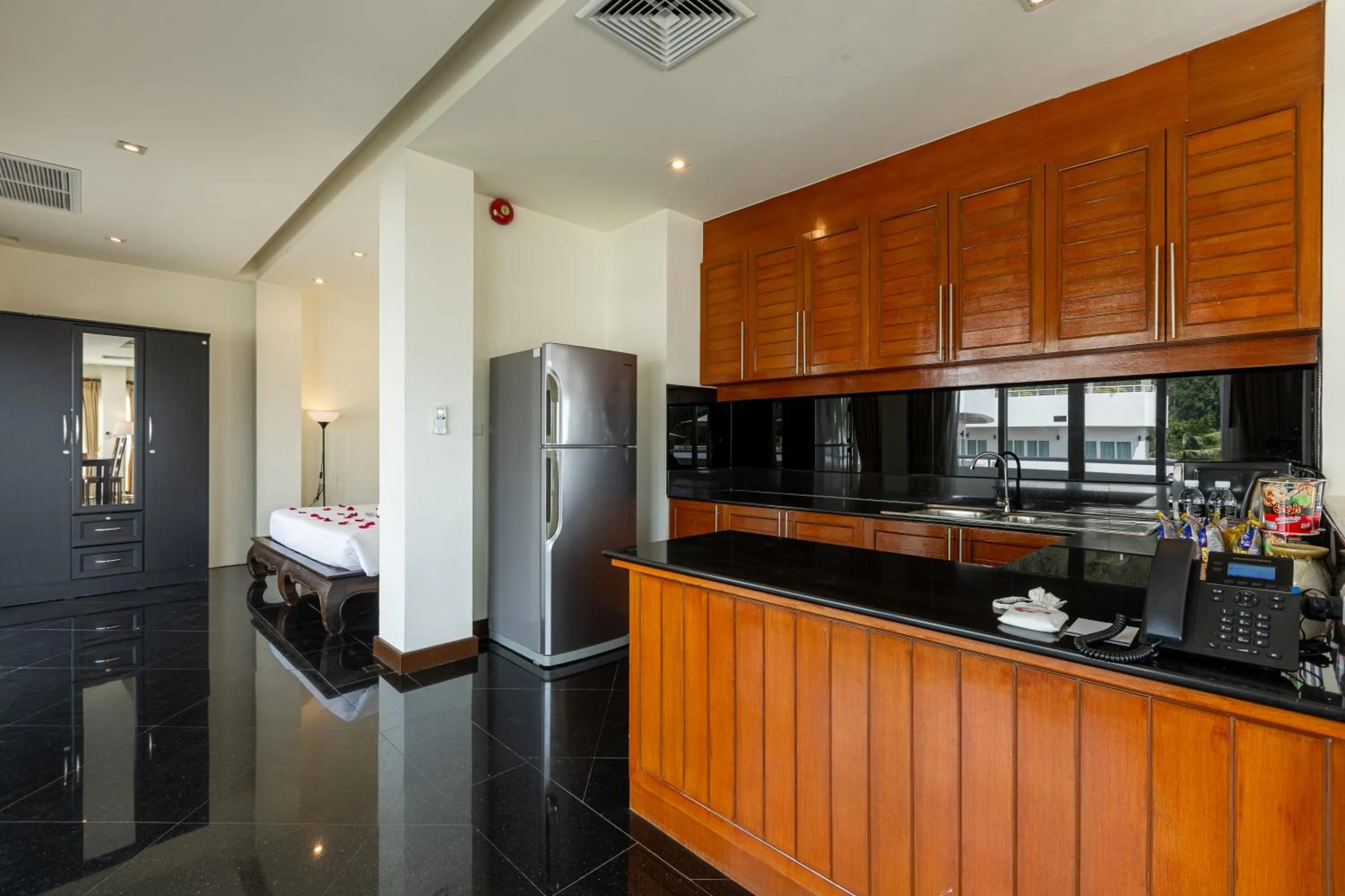 Kitchen or kitchenette in Phunawa Resort Phuket Karon Beach - SHA Plus