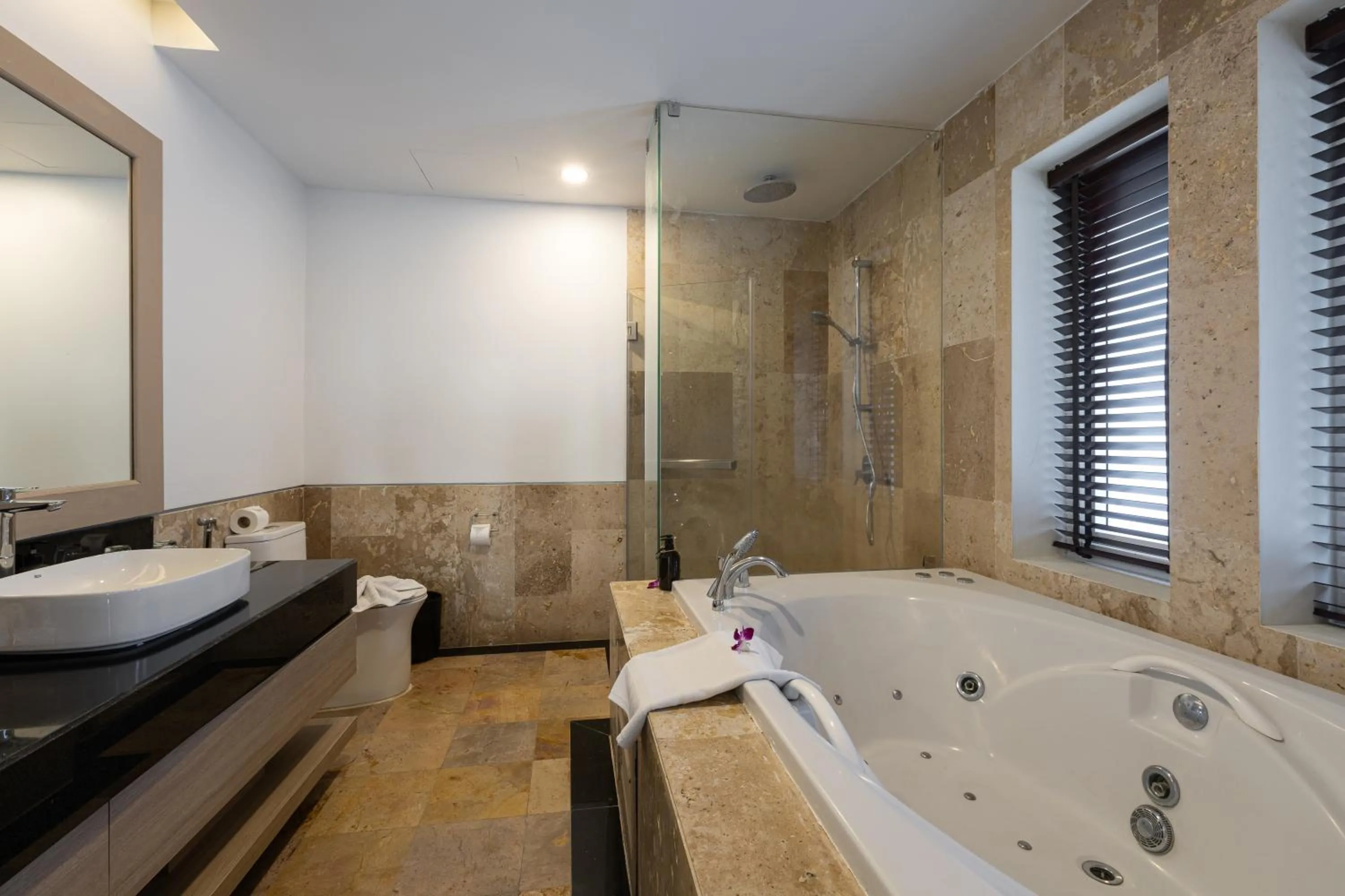 Bathroom in Phunawa Resort Phuket Karon Beach - SHA Plus