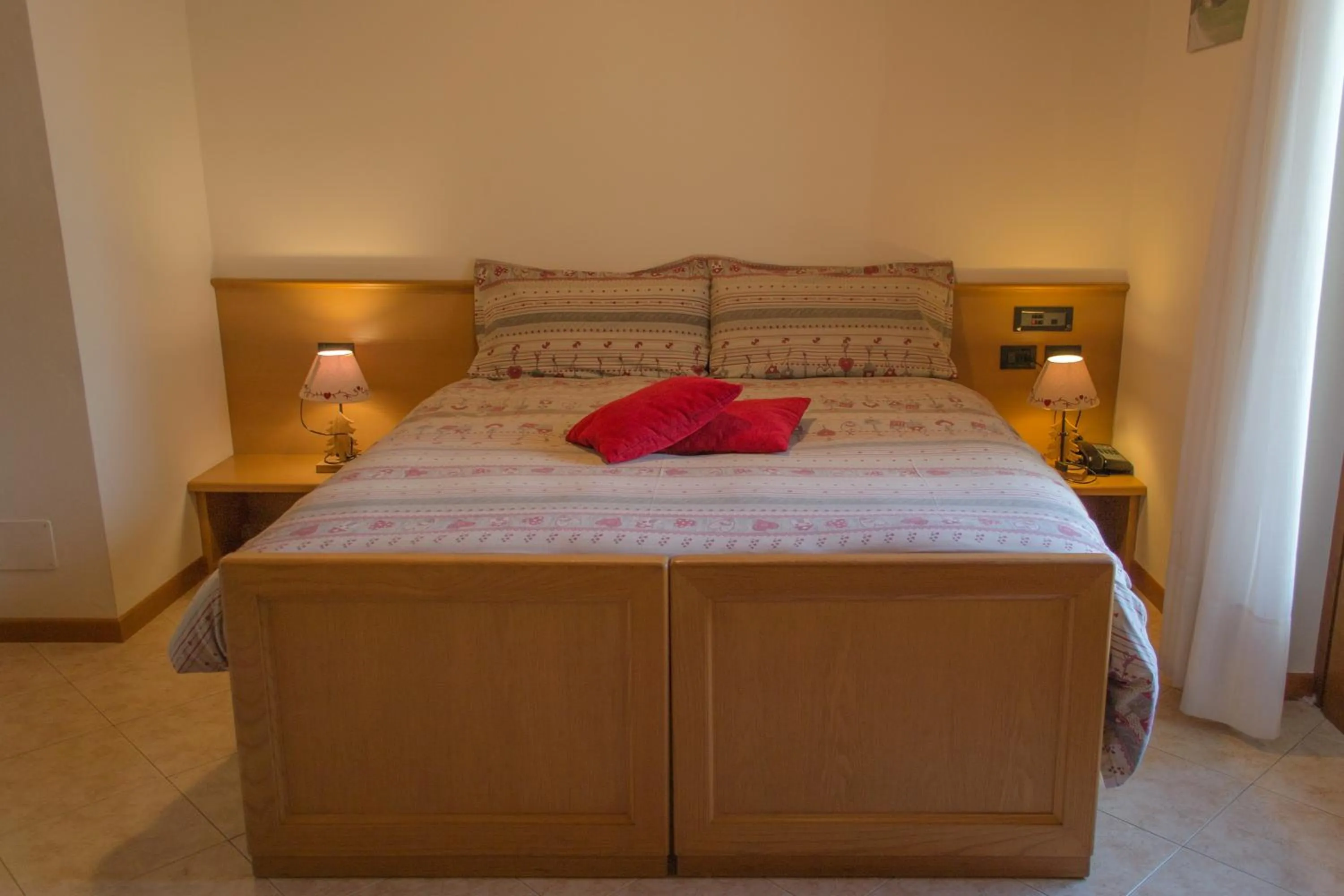 Bed in Meublè Rosalpina