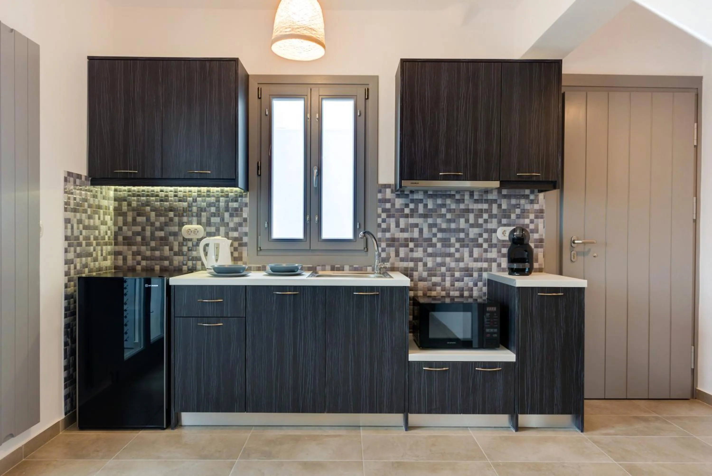 Kitchen or kitchenette in White Harmony Suites