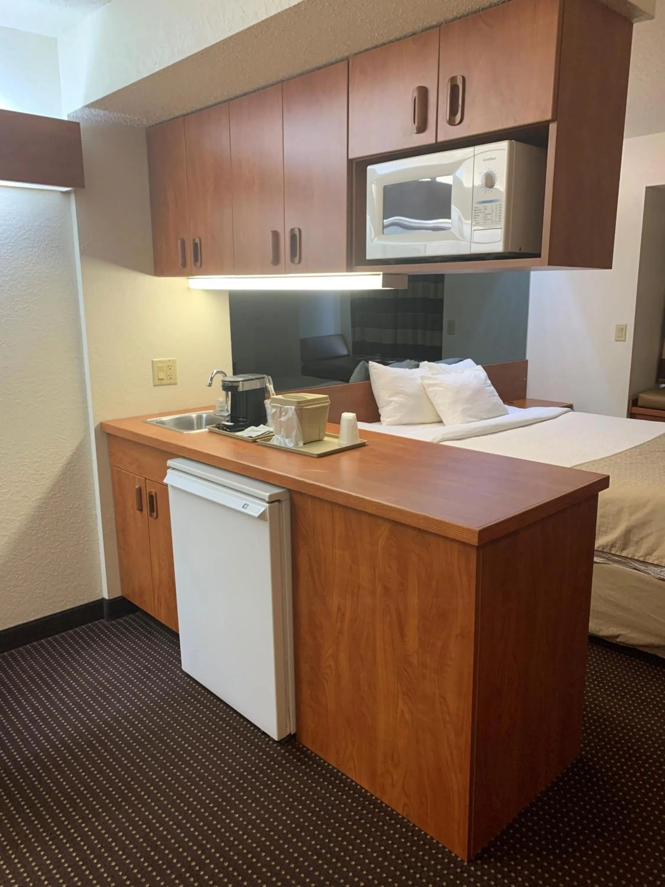 kitchen, Bed in Microtel Inn & Suites by Wyndham Rice Lake