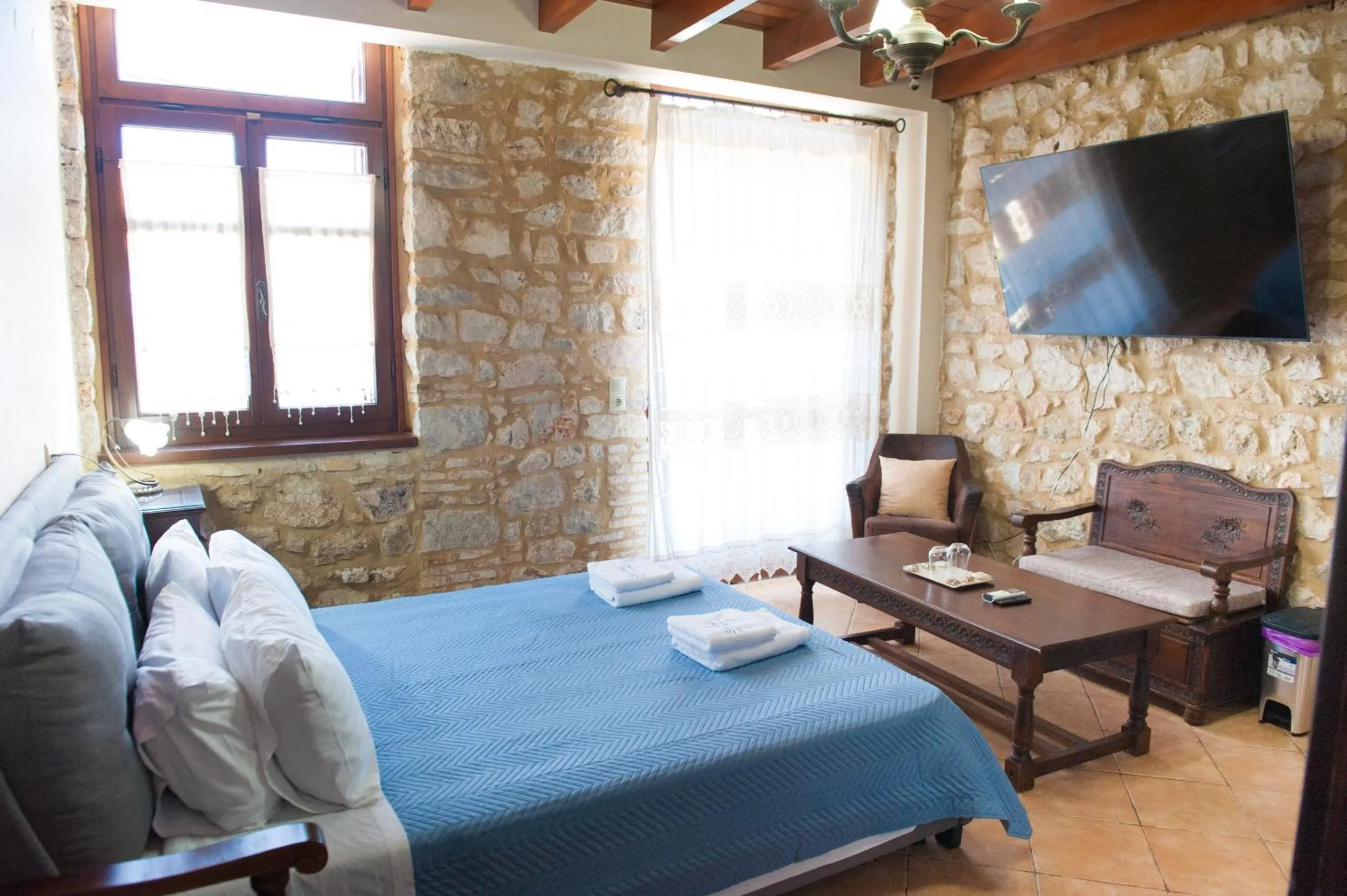 Photo of the whole room, Bed in SeaFront Stone Suites