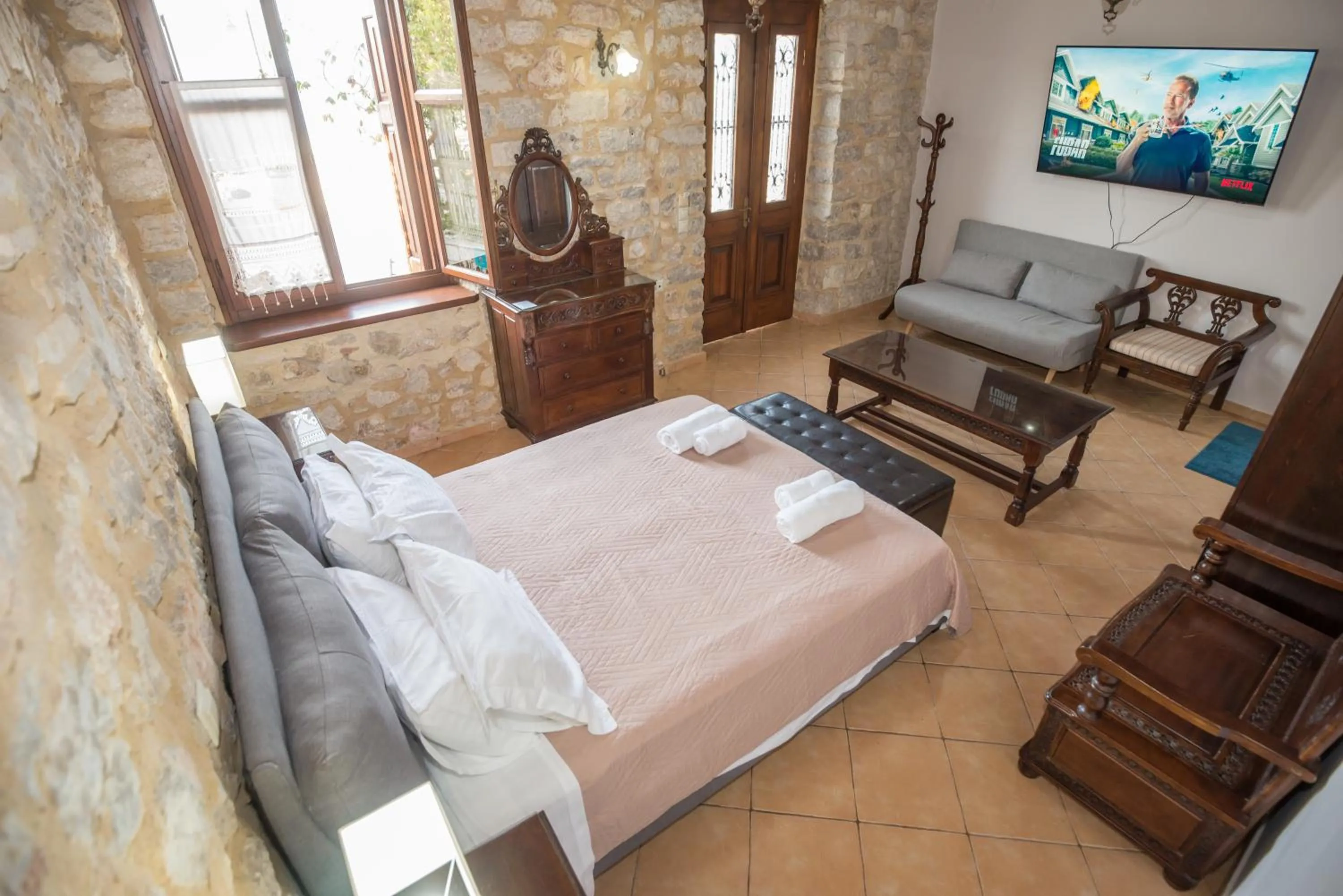 Photo of the whole room, Bed in SeaFront Stone Suites