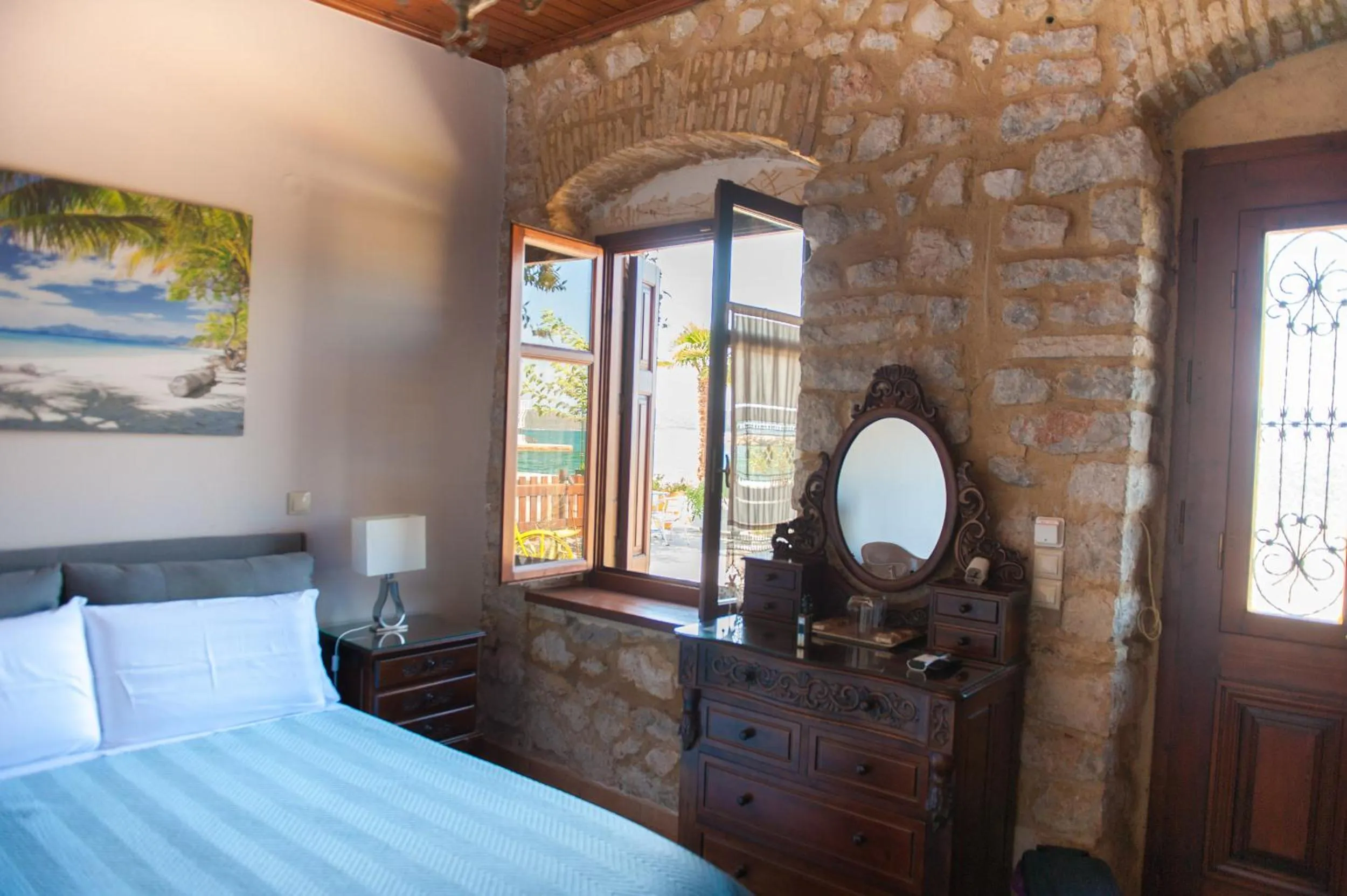 Photo of the whole room, Bed in SeaFront Stone Suites