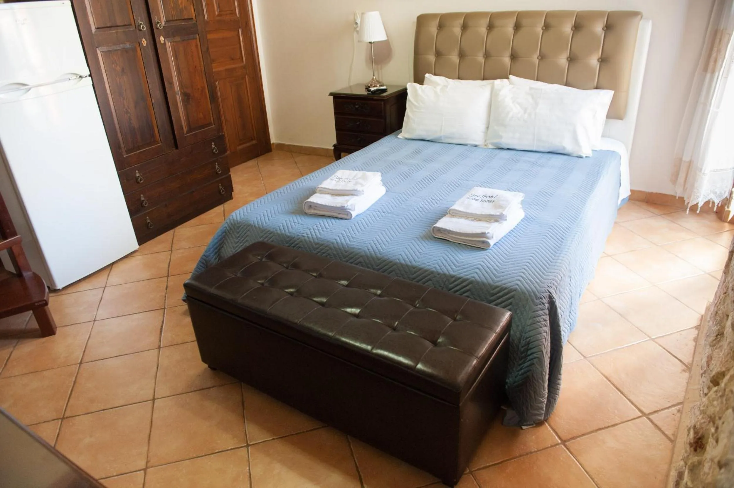 Photo of the whole room, Bed in SeaFront Stone Suites