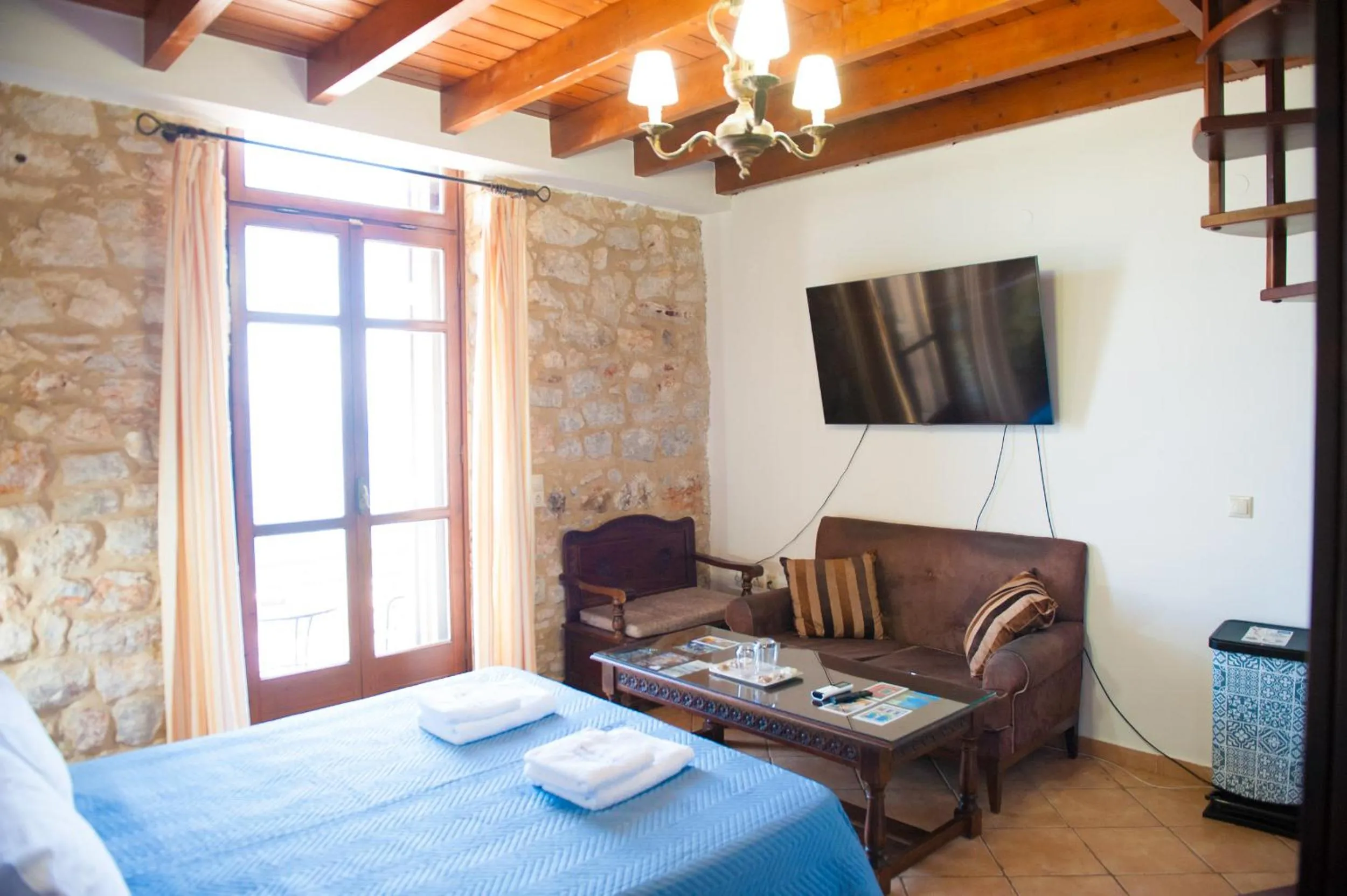 Photo of the whole room, Bed in SeaFront Stone Suites