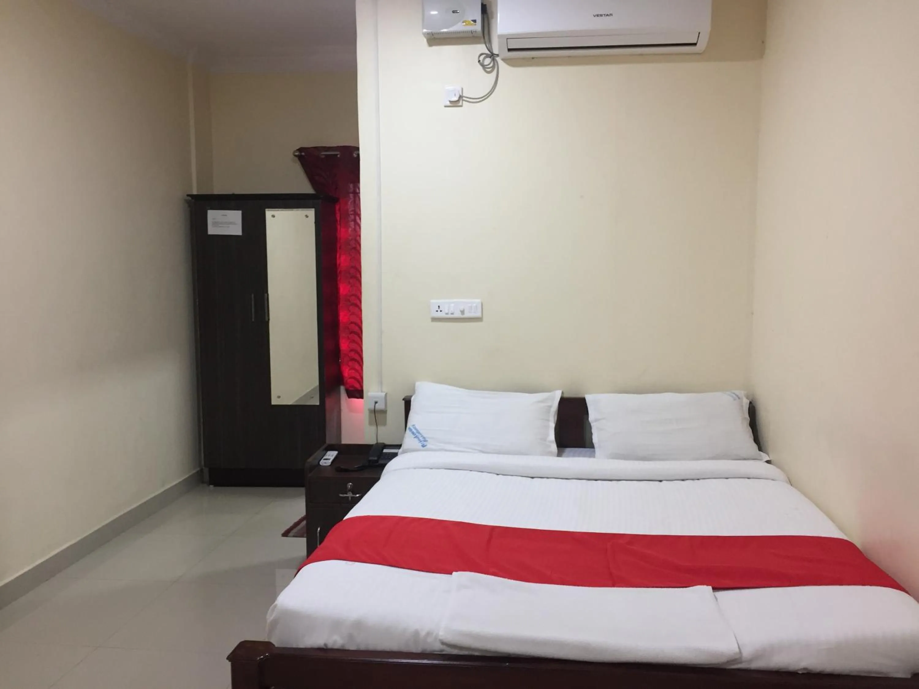 Photo of the whole room, Bed in Brindavan Residency