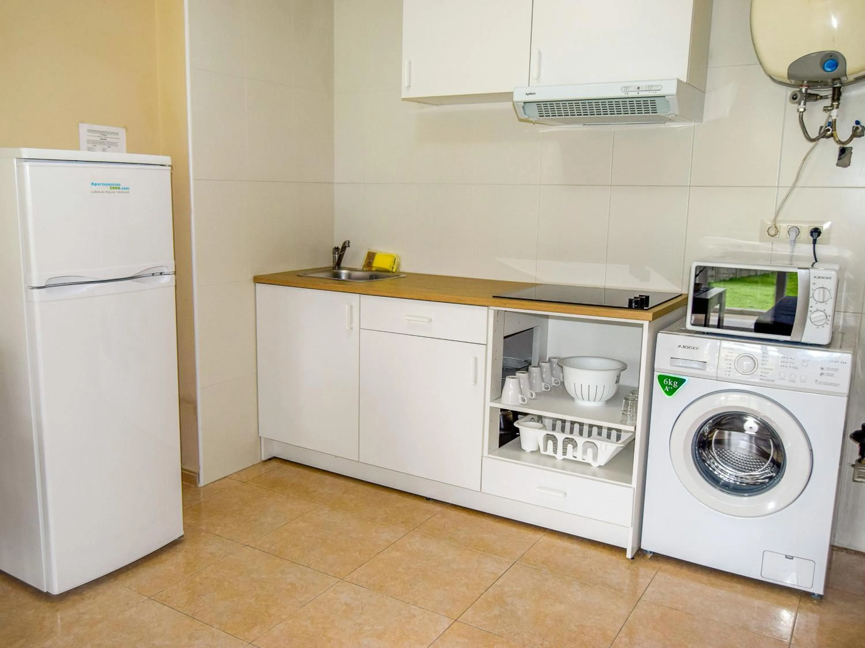Kitchen or kitchenette in Alojamientos Playa de las Catedrales 3000
