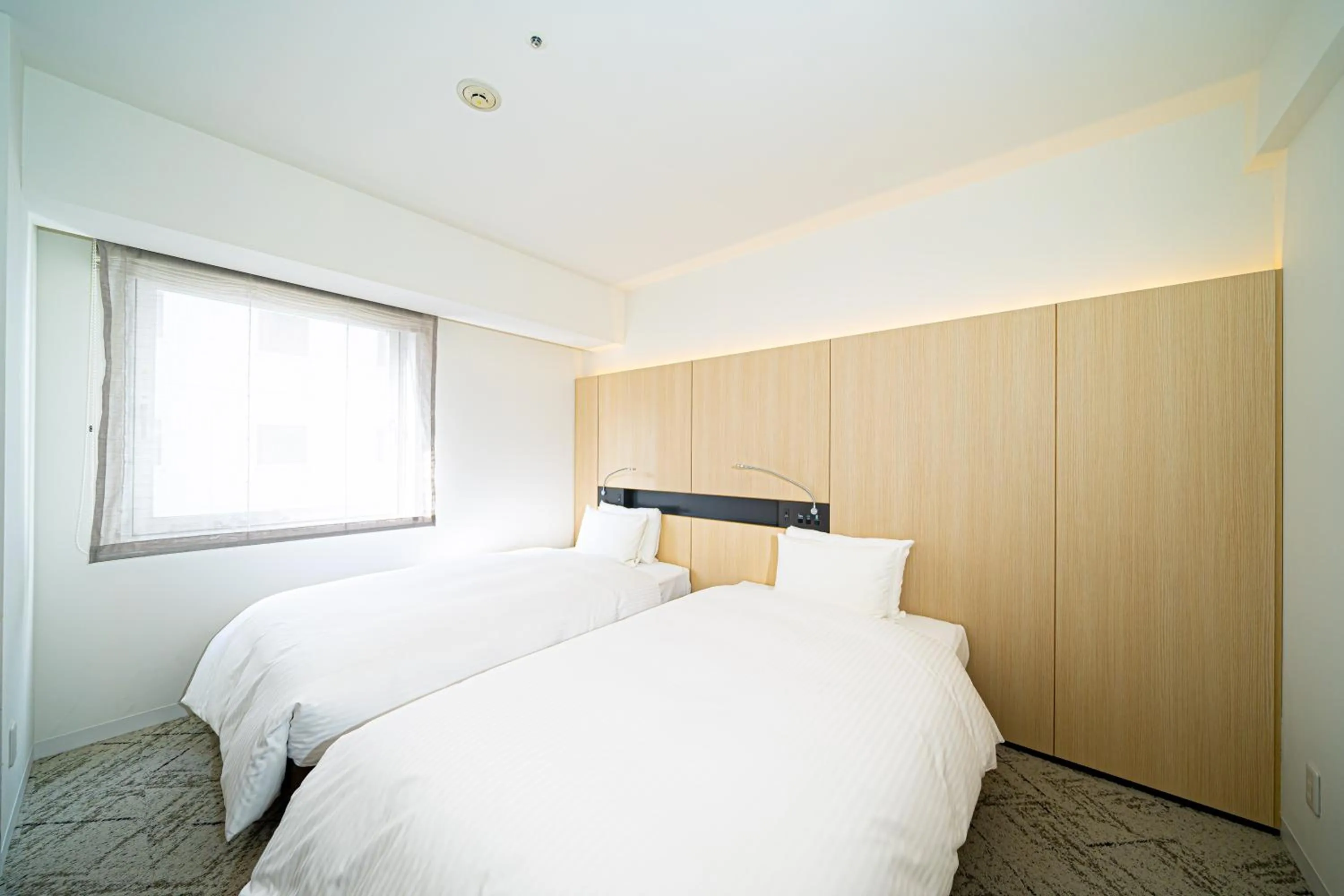 Bed in Hotel Sunroute Tokushima