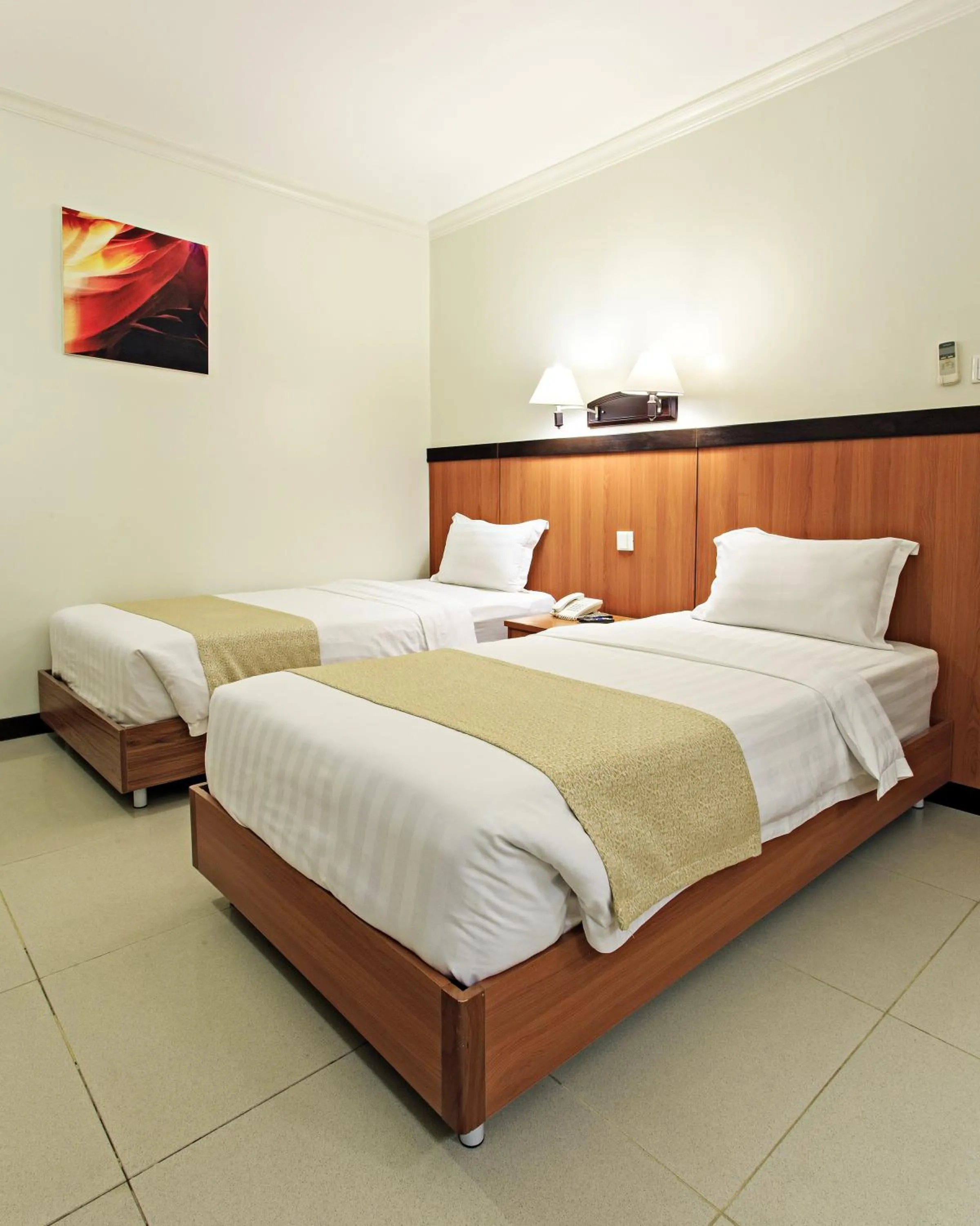 Photo of the whole room, Bed in The Orchard Cebu Hotel & Suites powered by Cocotel