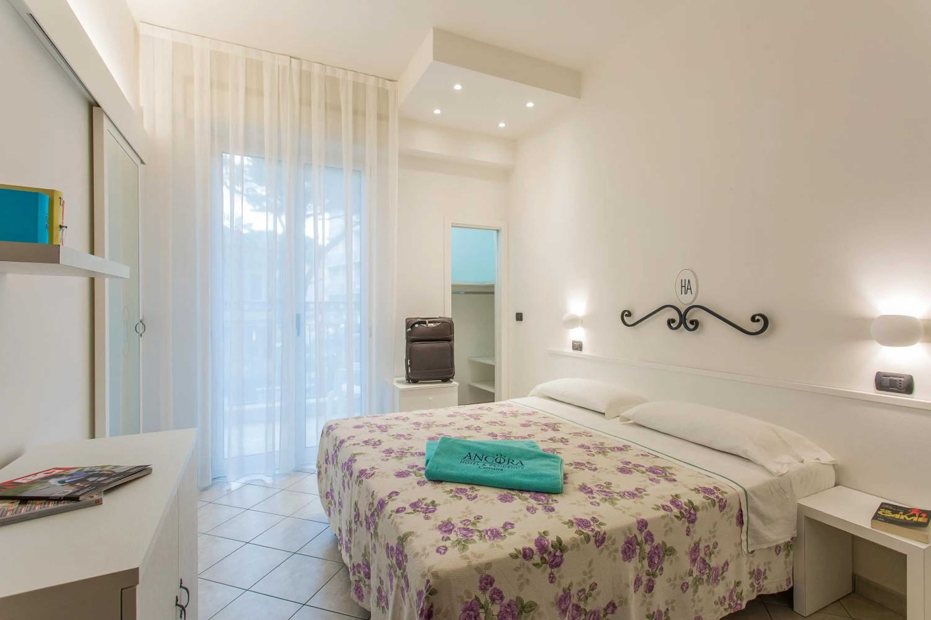 Bed in Ancora Hotel & Residence