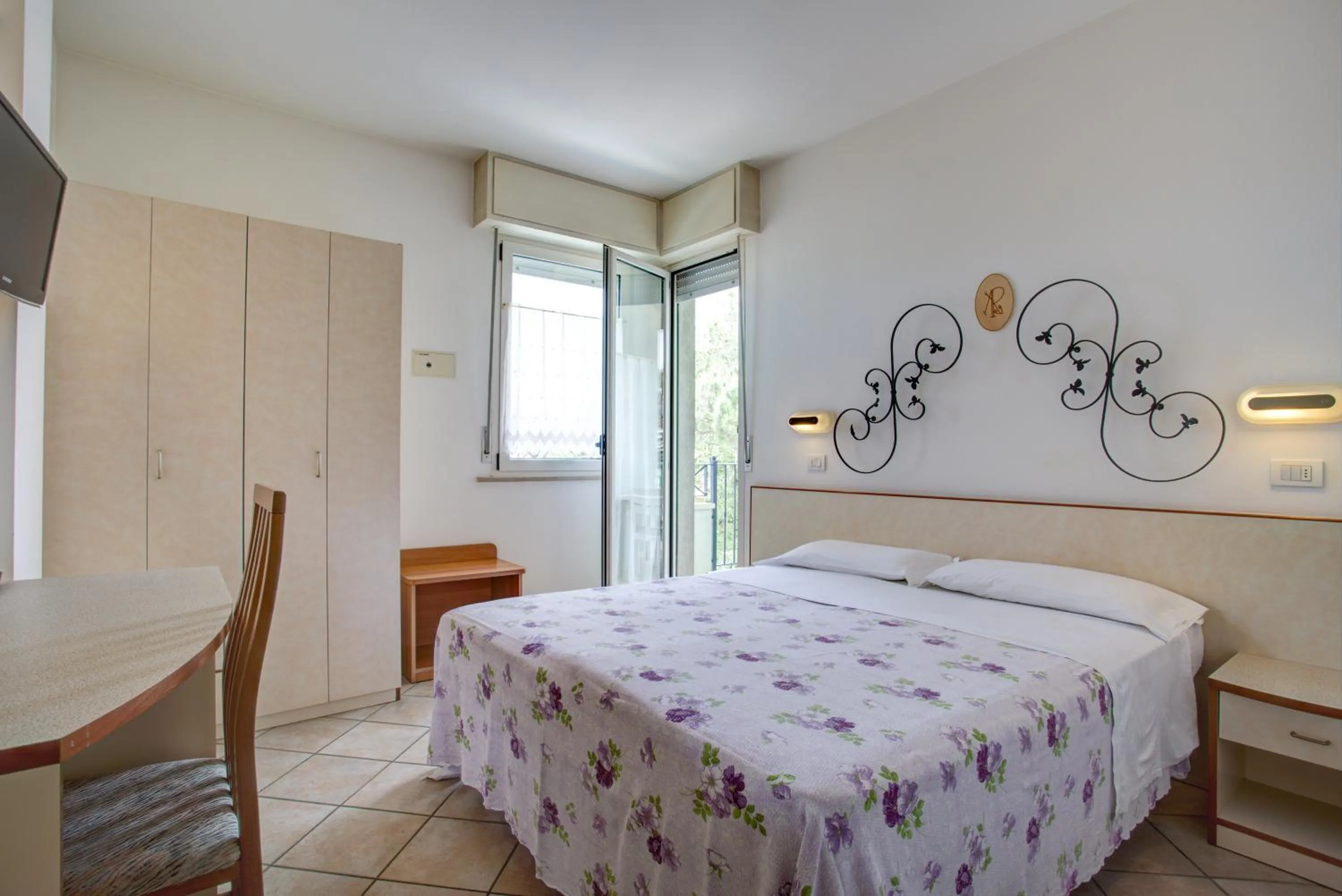 Bed in Ancora Hotel & Residence