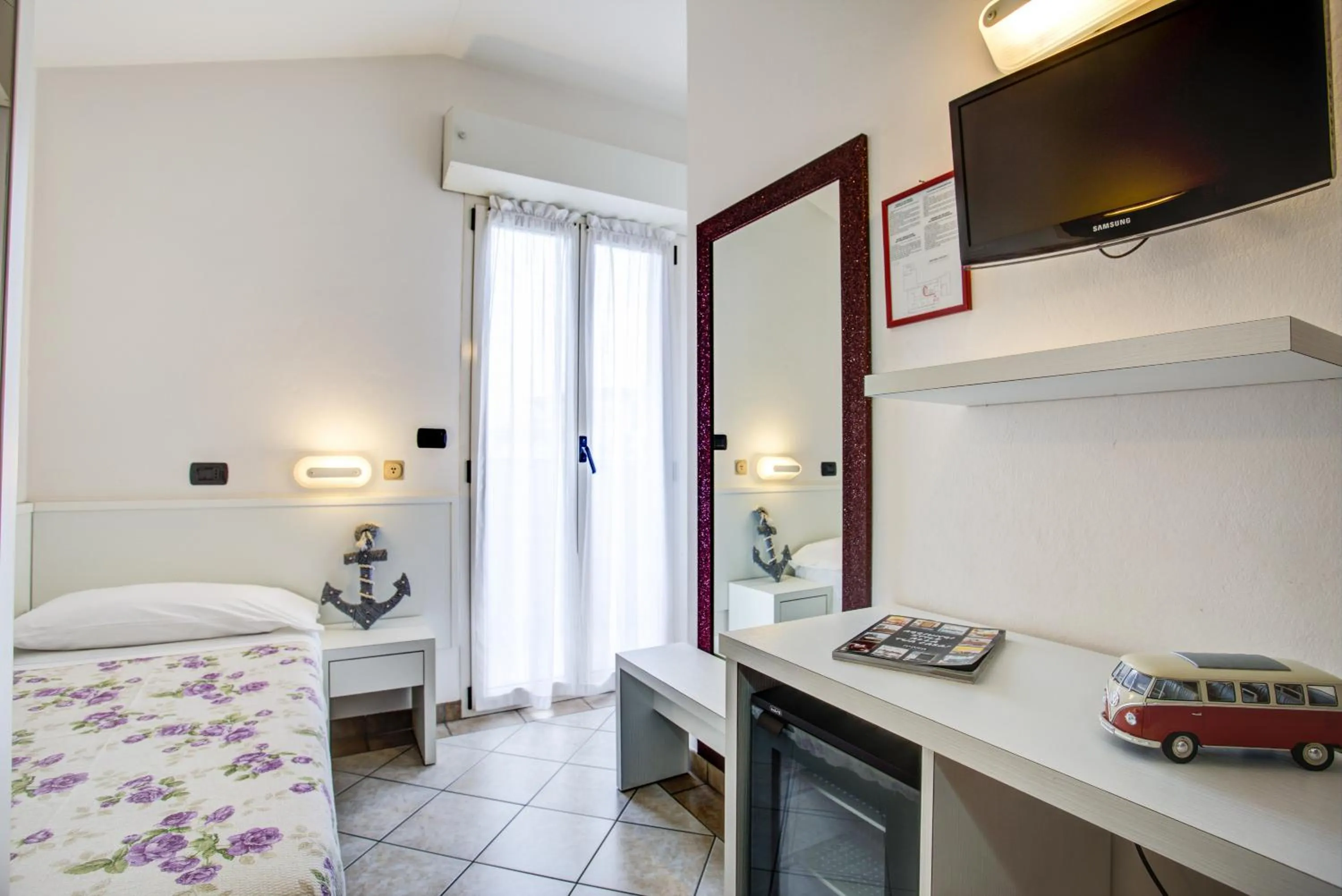 Bed in Ancora Hotel & Residence