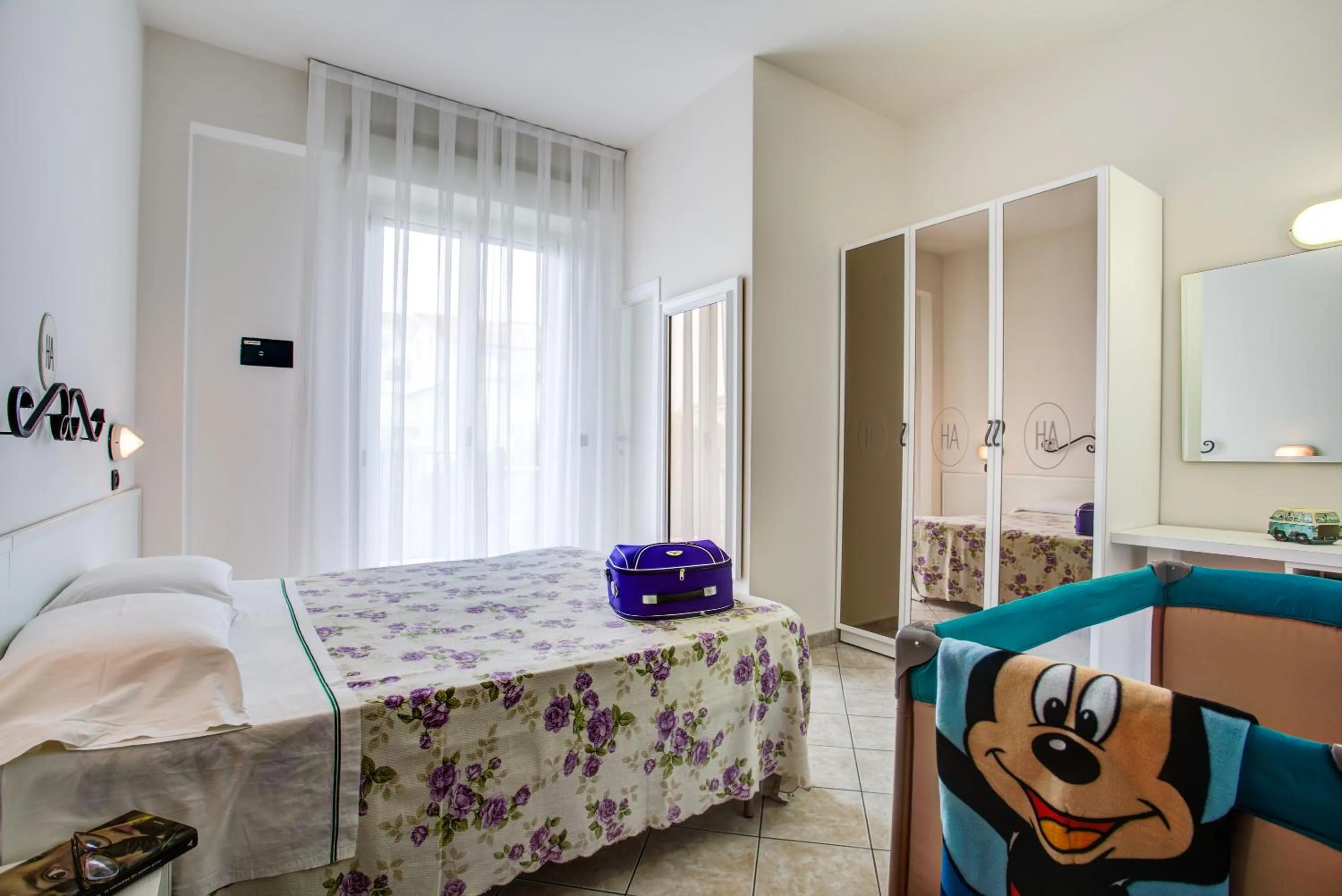 Bed in Ancora Hotel & Residence