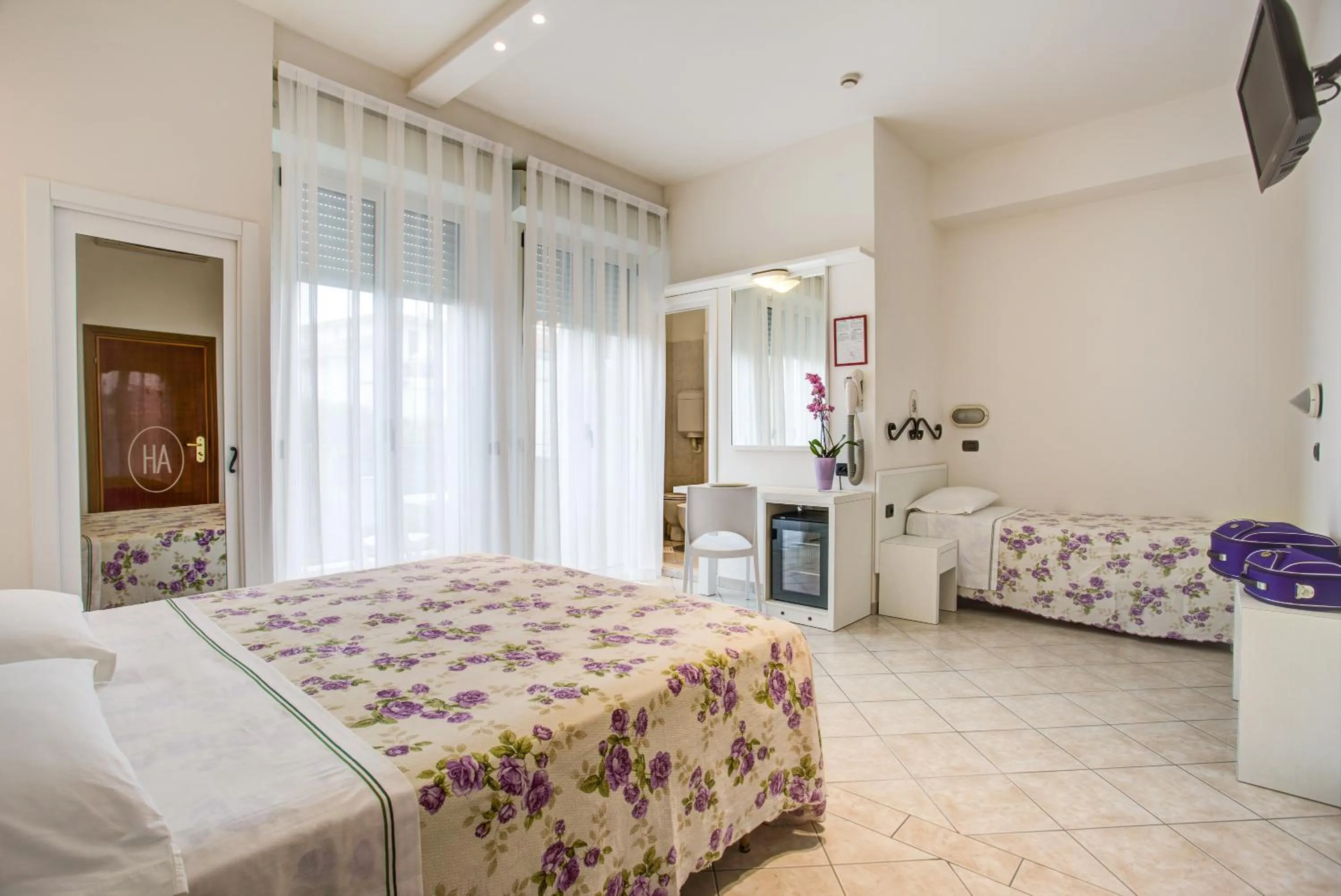 Bed in Ancora Hotel & Residence