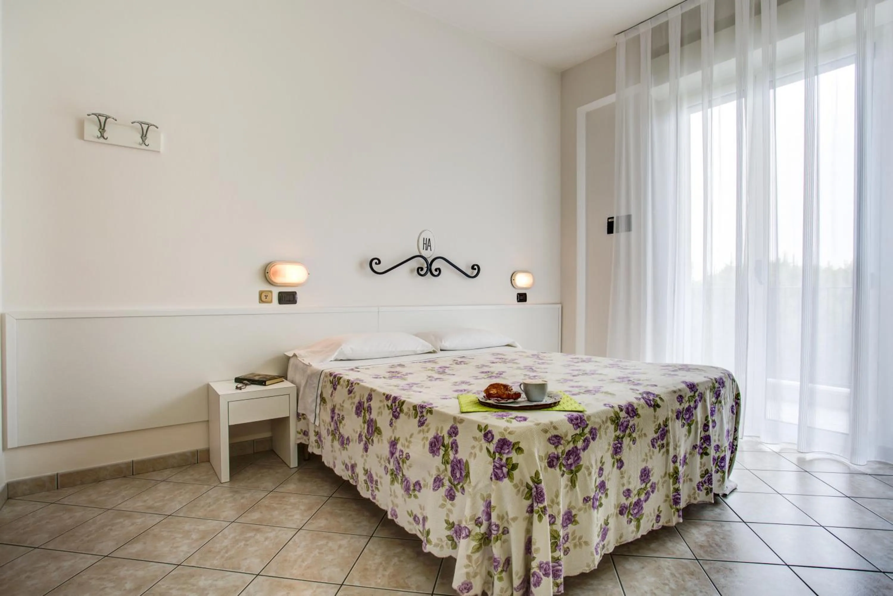 Bed in Ancora Hotel & Residence