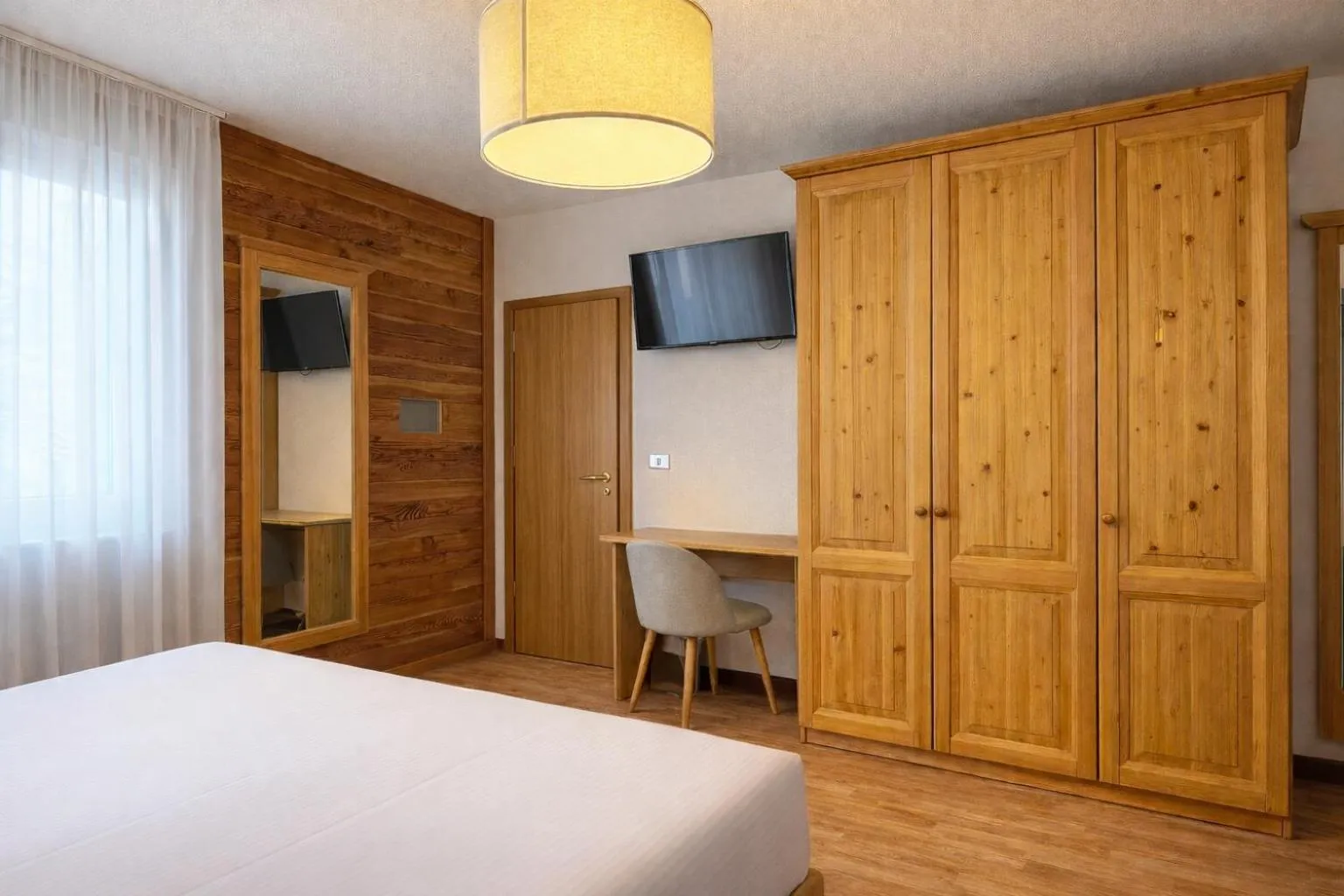 Bed in Hotel Rododendro Val di Fassa