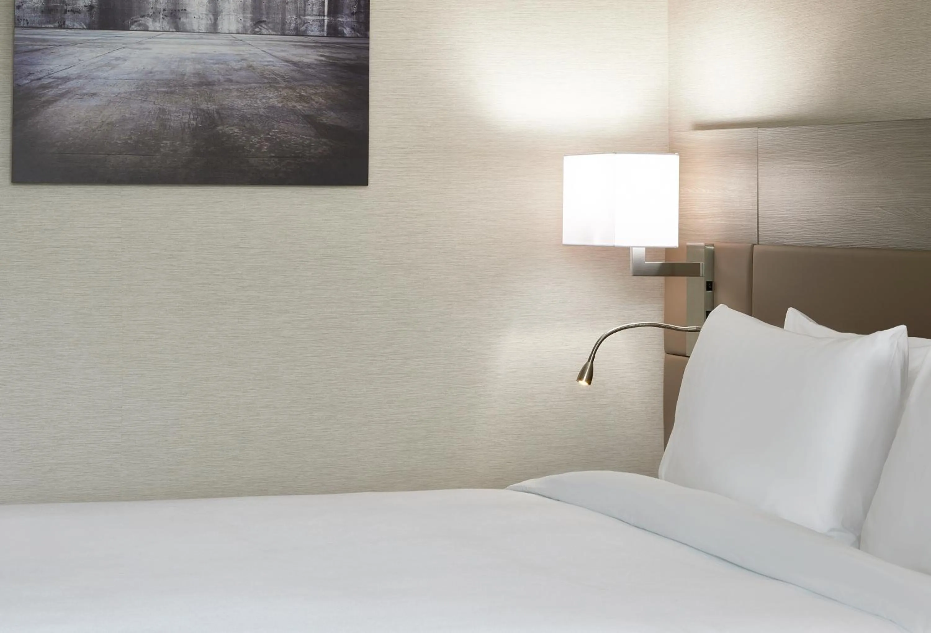 Bed in AC Hotel by Marriott Cleveland Beachwood