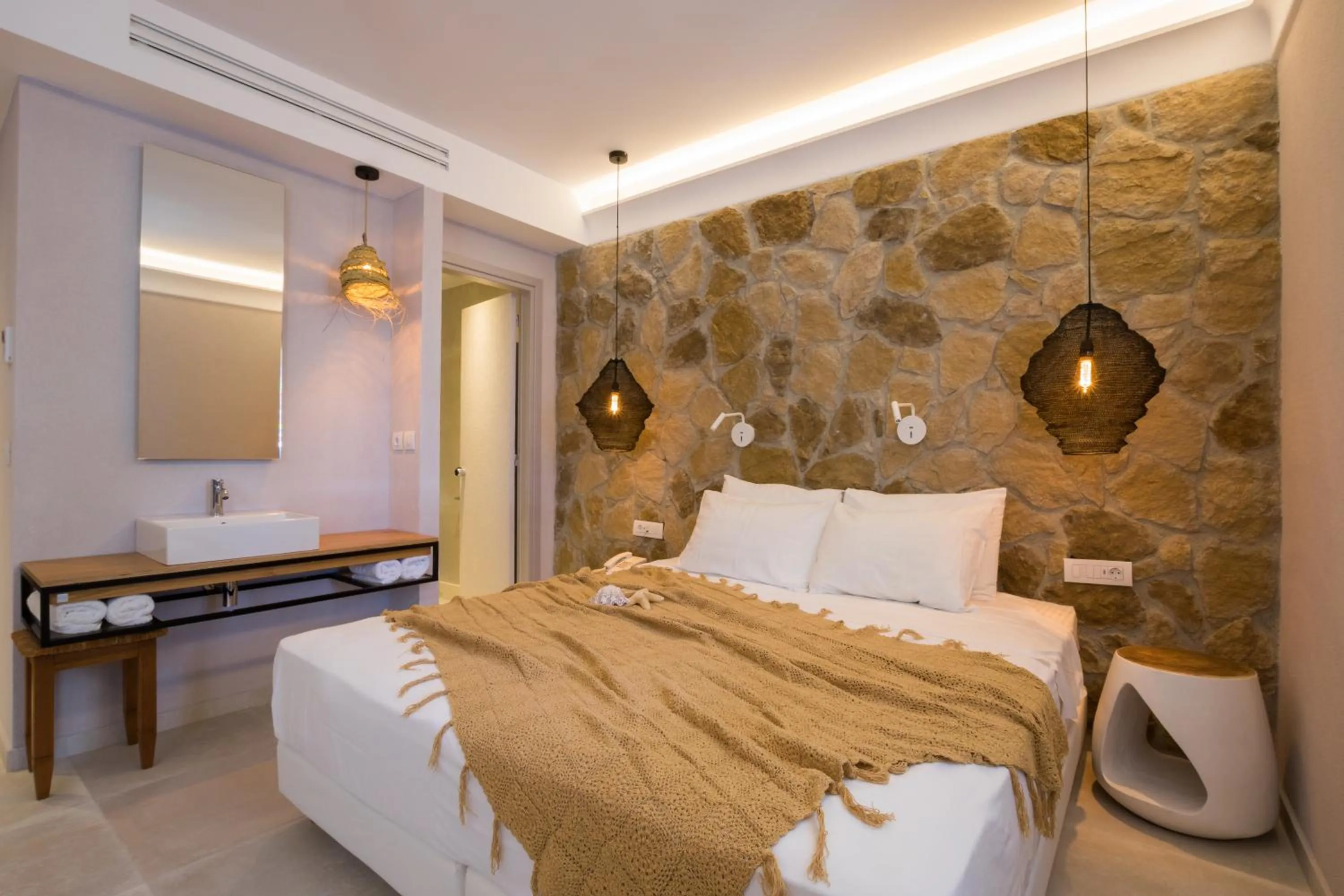 Bed in Aegean Village Beachfront Resort