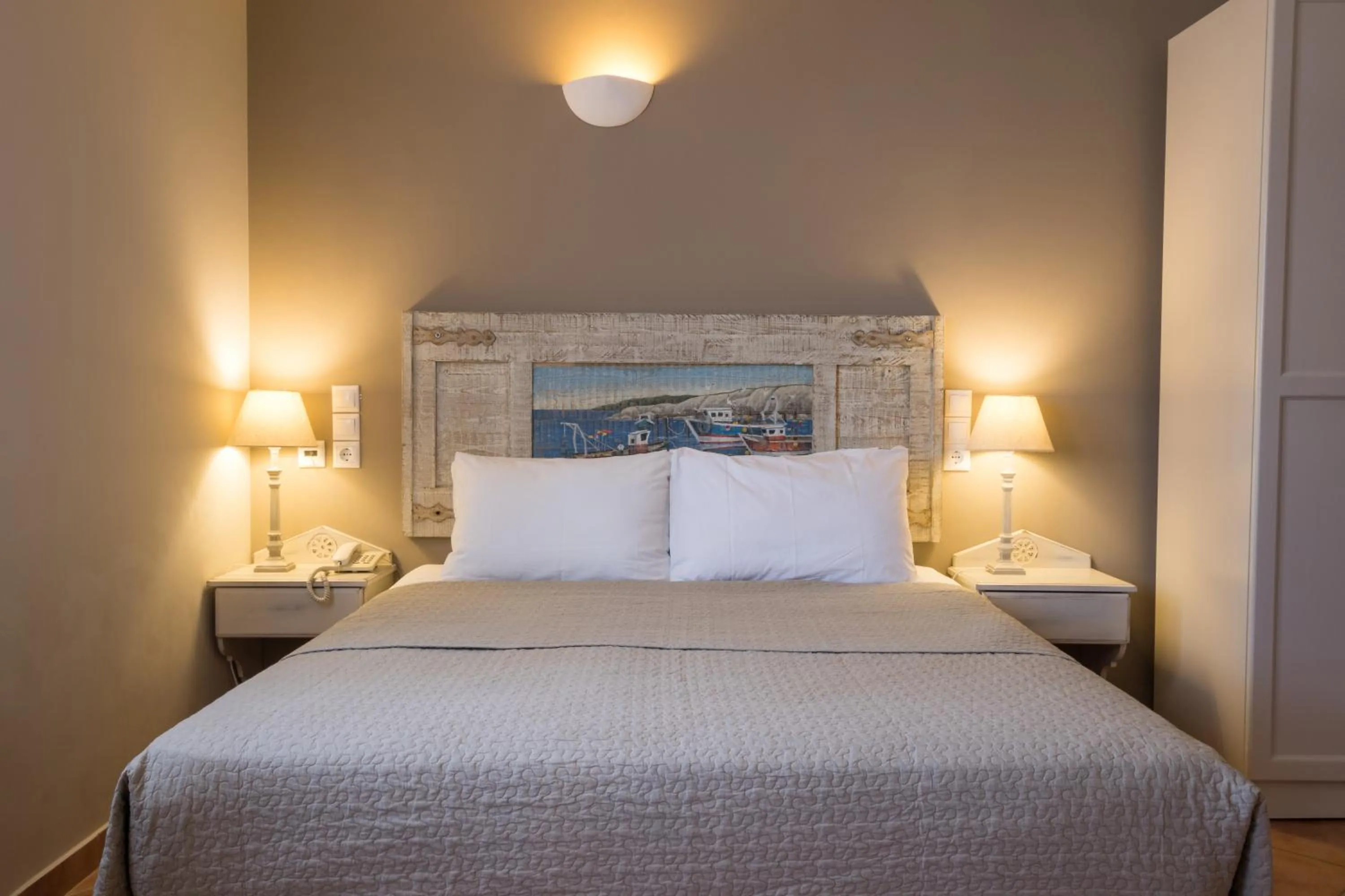 Bed in Aegean Village Beachfront Resort