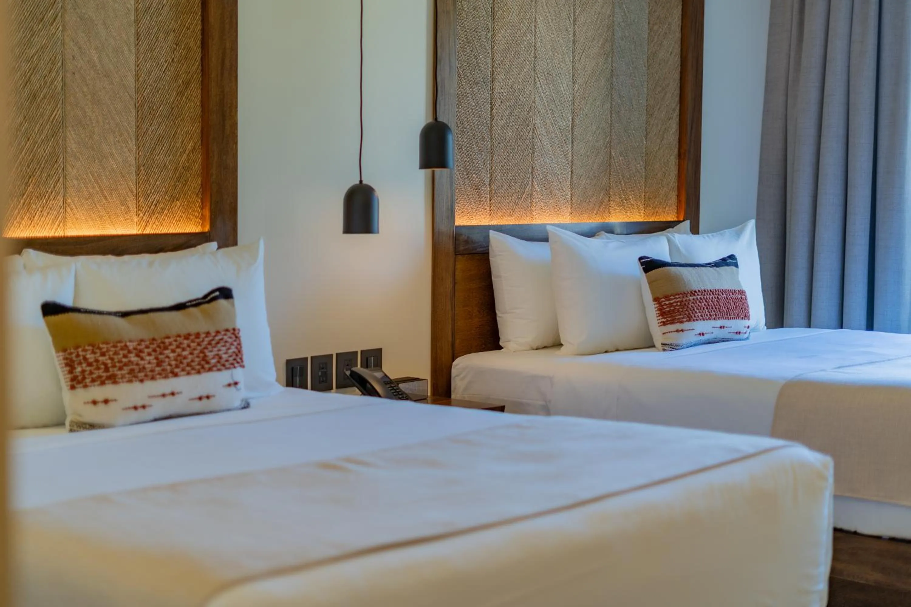 Bed in Hotel Indigo La Paz Puerta Cortes by IHG