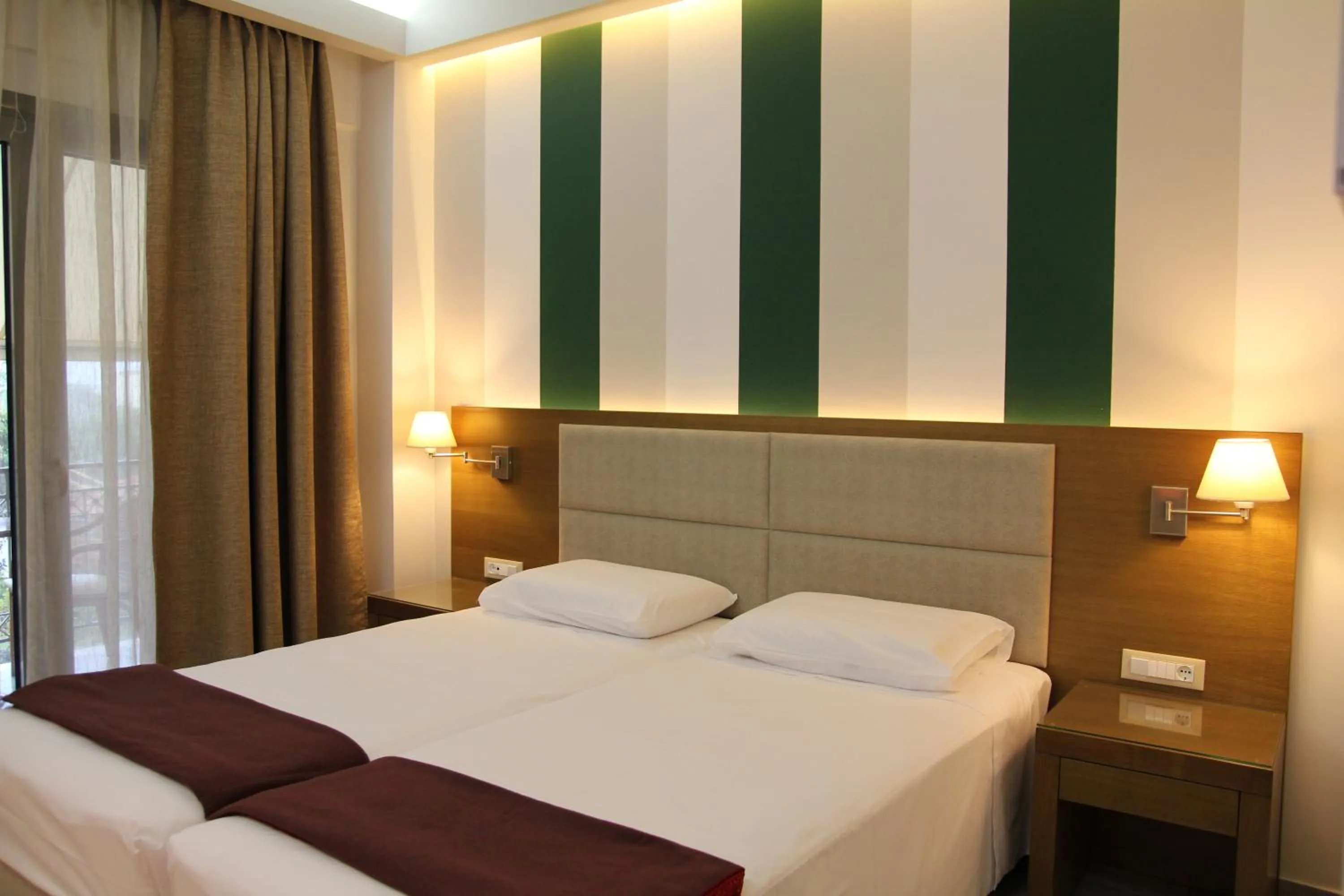 Bed in Achilles Hotel