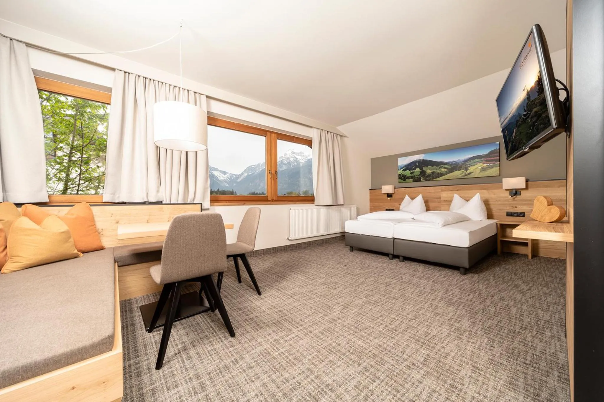 Seating area, Bed in Hotel Stockerwirt