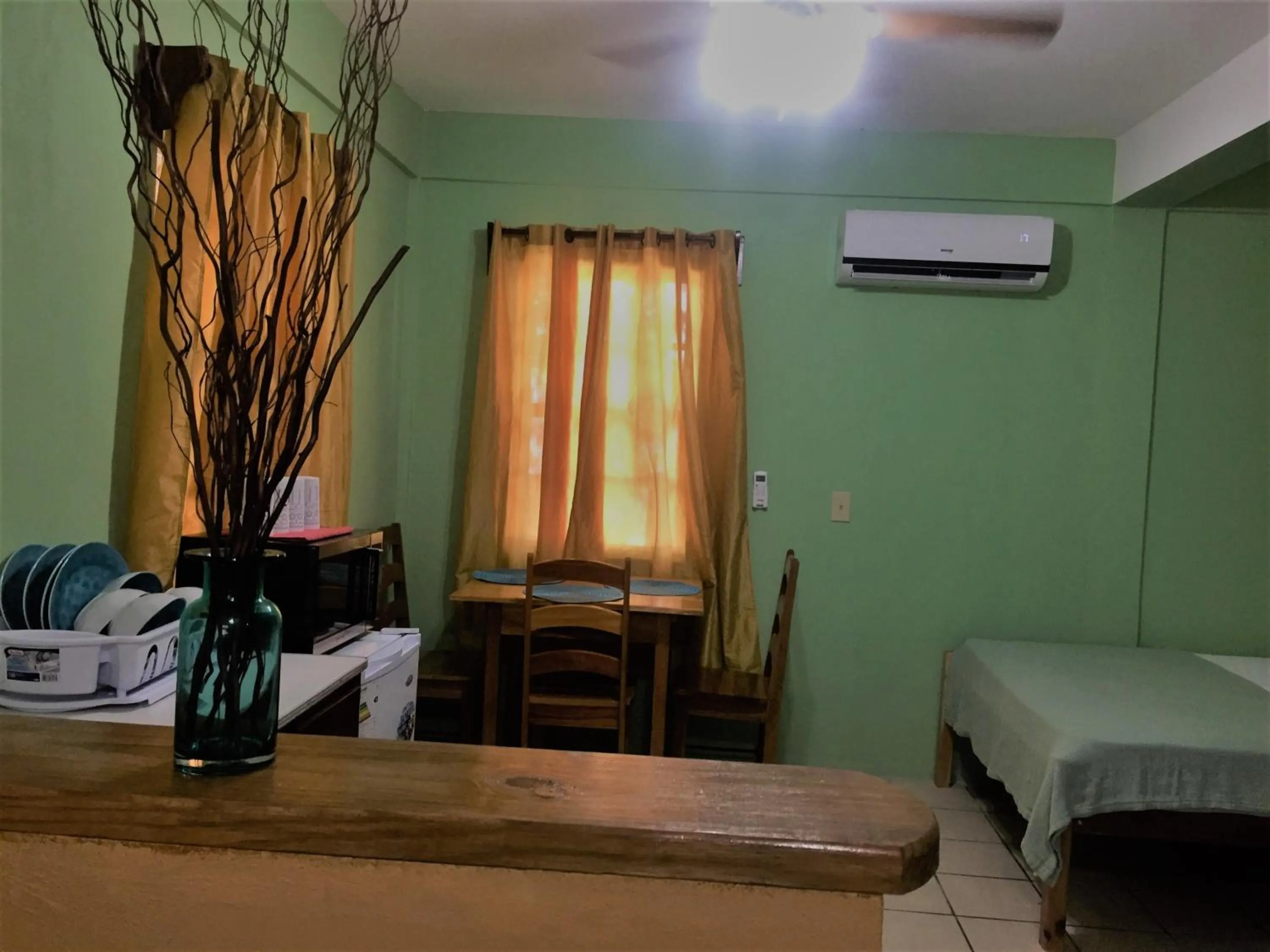 Bed in Ambergris Sunset Hotel