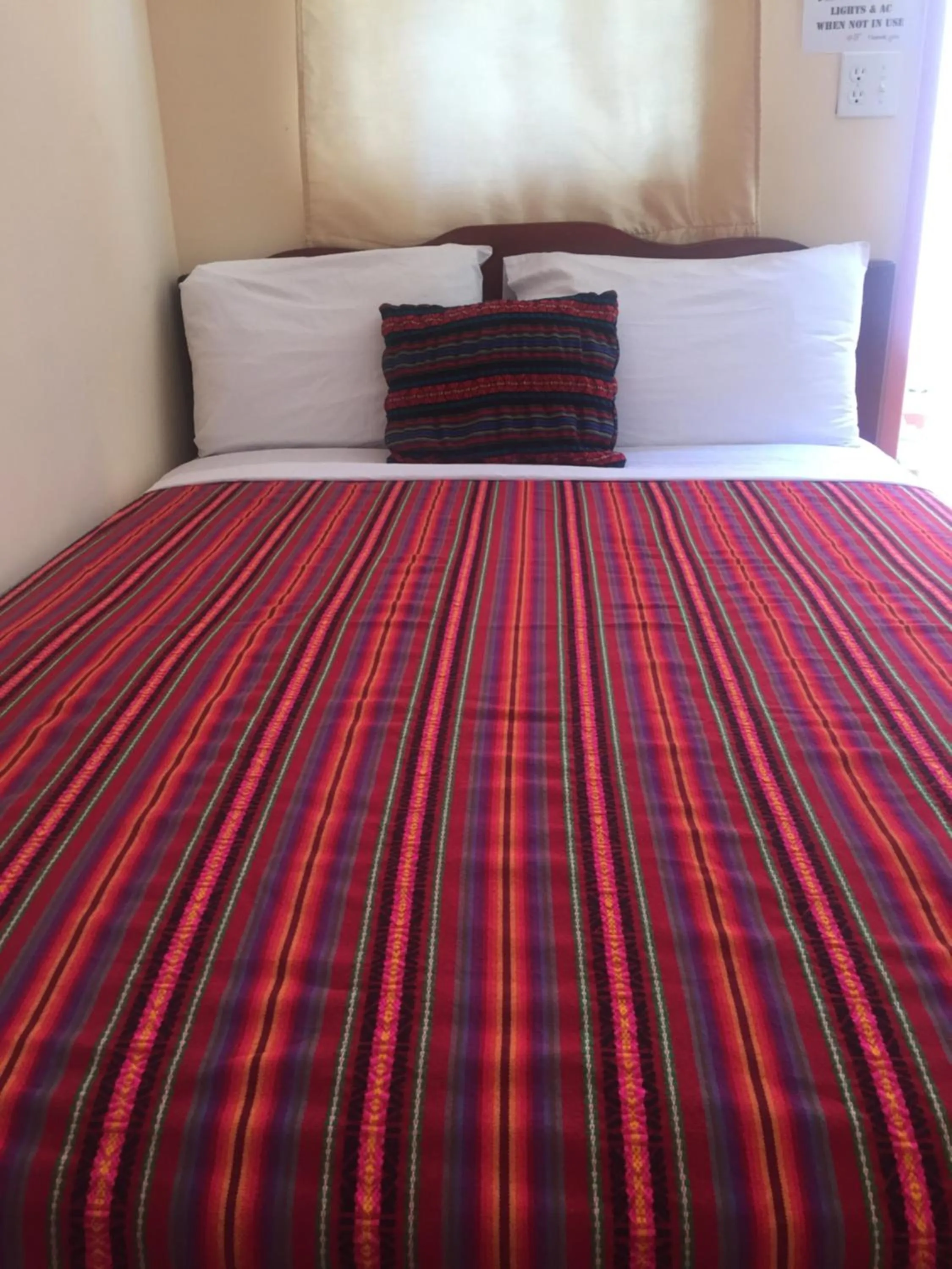 Bed in Ambergris Sunset Hotel