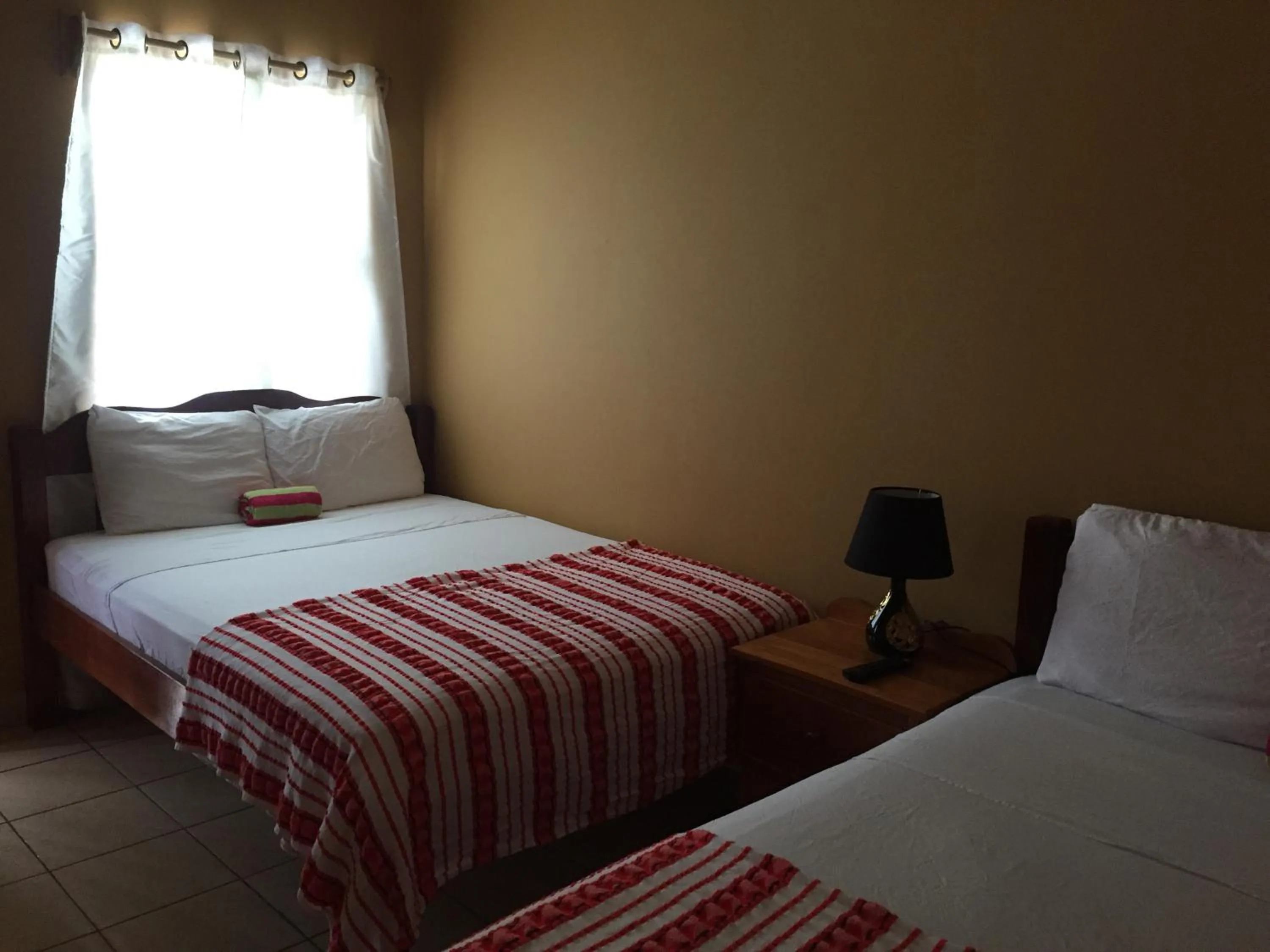 Bed in Ambergris Sunset Hotel